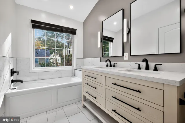 a bathroom with a bathtub and a sink