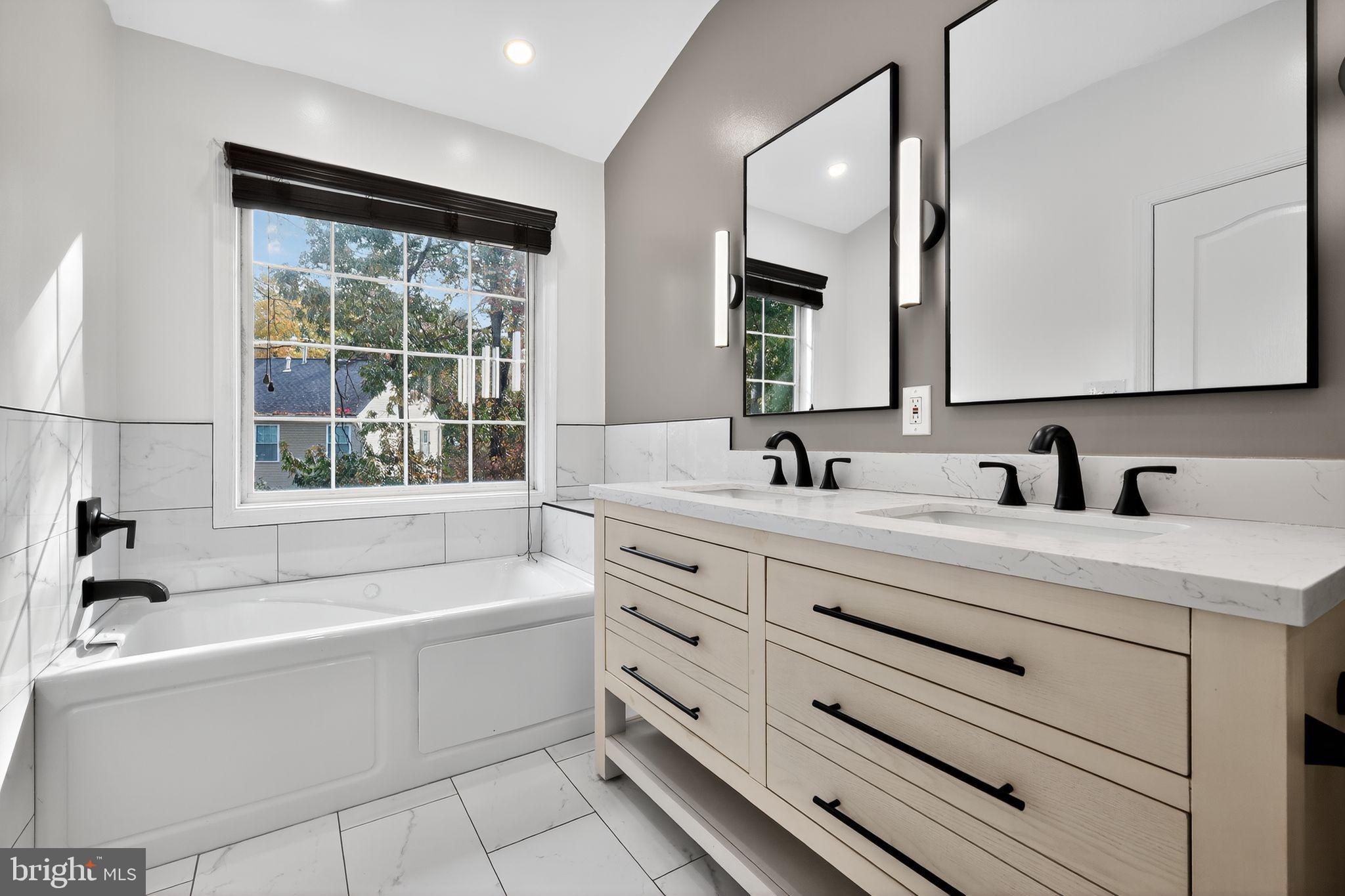 1707 Severn Tree Court Severn, MD 21144 - Photo 22 of 37 a bathroom with a bathtub and a sink