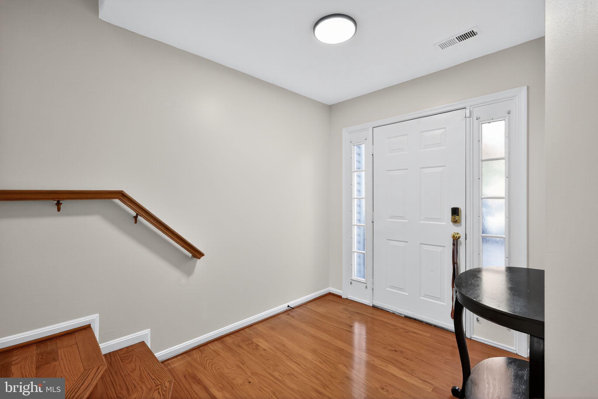 1707 Severn Tree Court Severn, MD 21144 - Photo 4 of 37 a view of an empty room with wooden floor