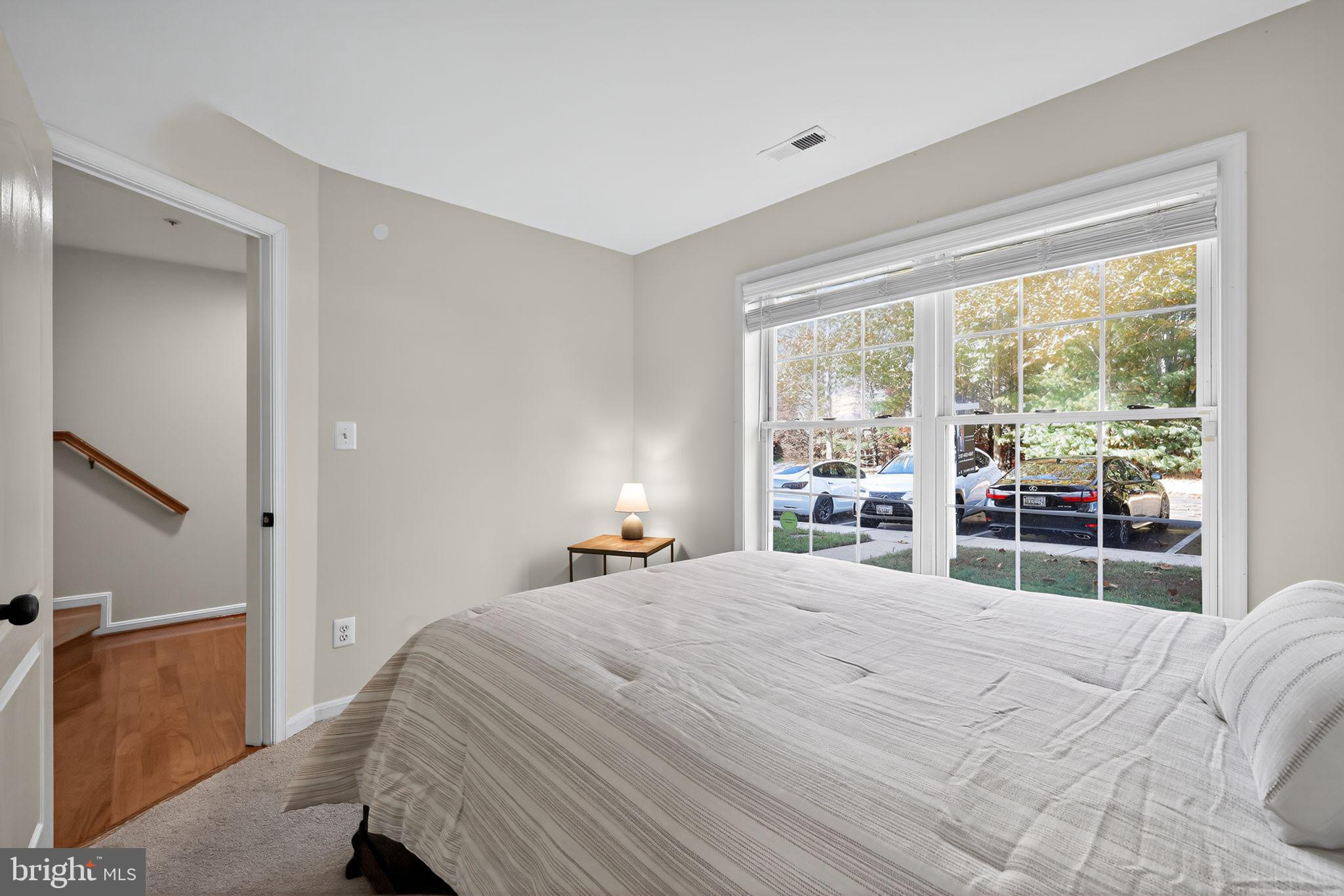 1707 Severn Tree Court Severn, MD 21144 - Photo 7 of 37 a bedroom with a bed and a large window