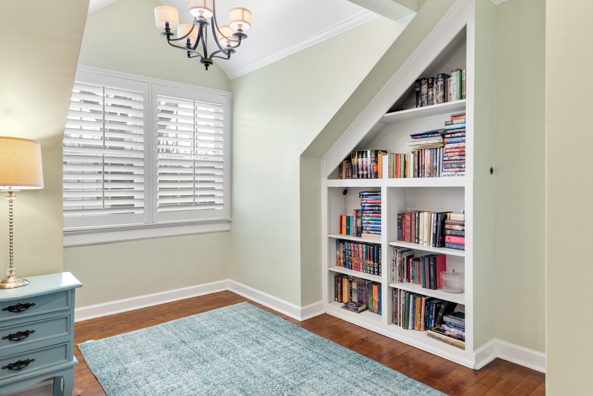1002 Sutton Hill Road Nashville, TN 37204 - Photo 15 of 40 a living room with a book shelf and a window