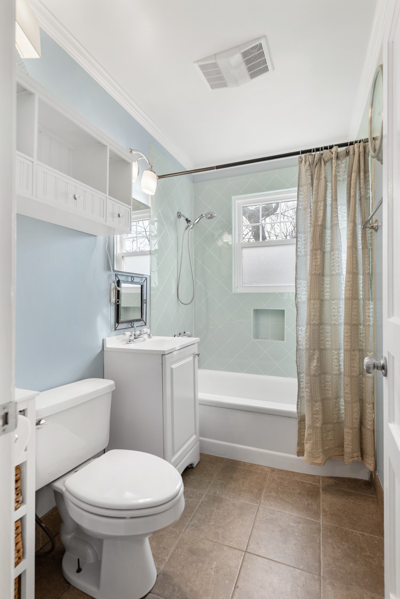 1002 Sutton Hill Road Nashville, TN 37204 - Photo 22 of 40 a bathroom with a toilet sink and shower