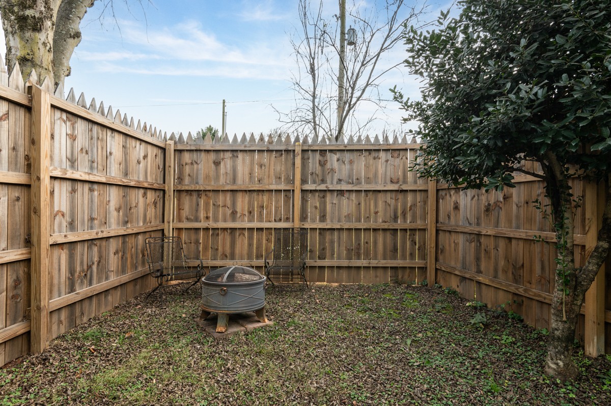 1002 Sutton Hill Road Nashville, TN 37204 - Photo 39 of 40 a backyard of a house with lots of water fountain and wooden fence