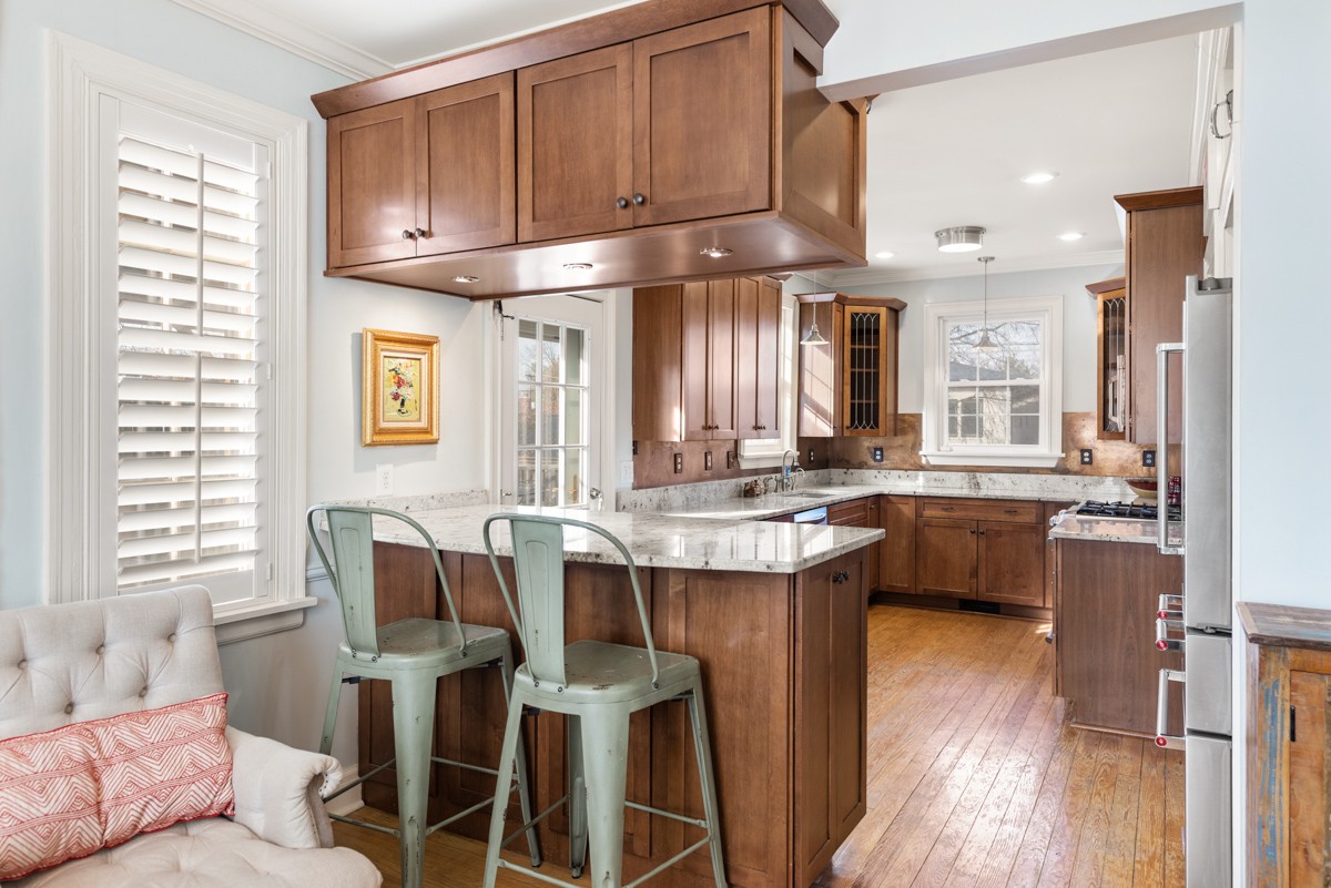 1002 Sutton Hill Road Nashville, TN 37204 - Photo 6 of 40 a kitchen with a sink cabinets and wooden floor