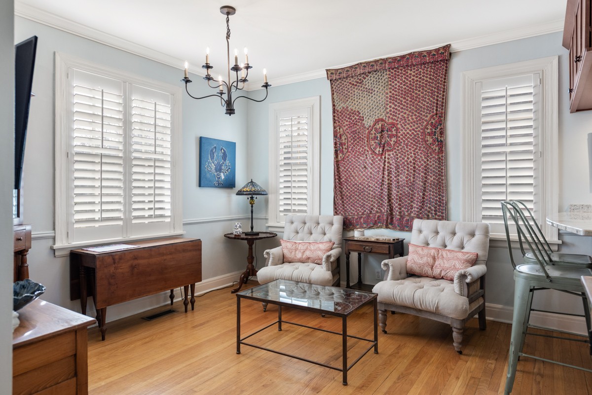 1002 Sutton Hill Road Nashville, TN 37204 - Photo 9 of 40 a living room with furniture and a chandelier