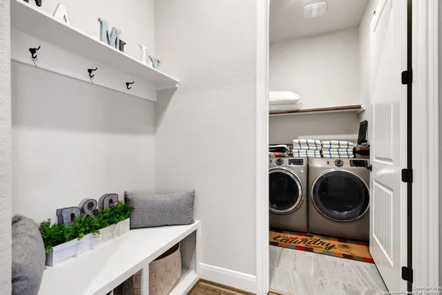 a utility room with dryer and washer