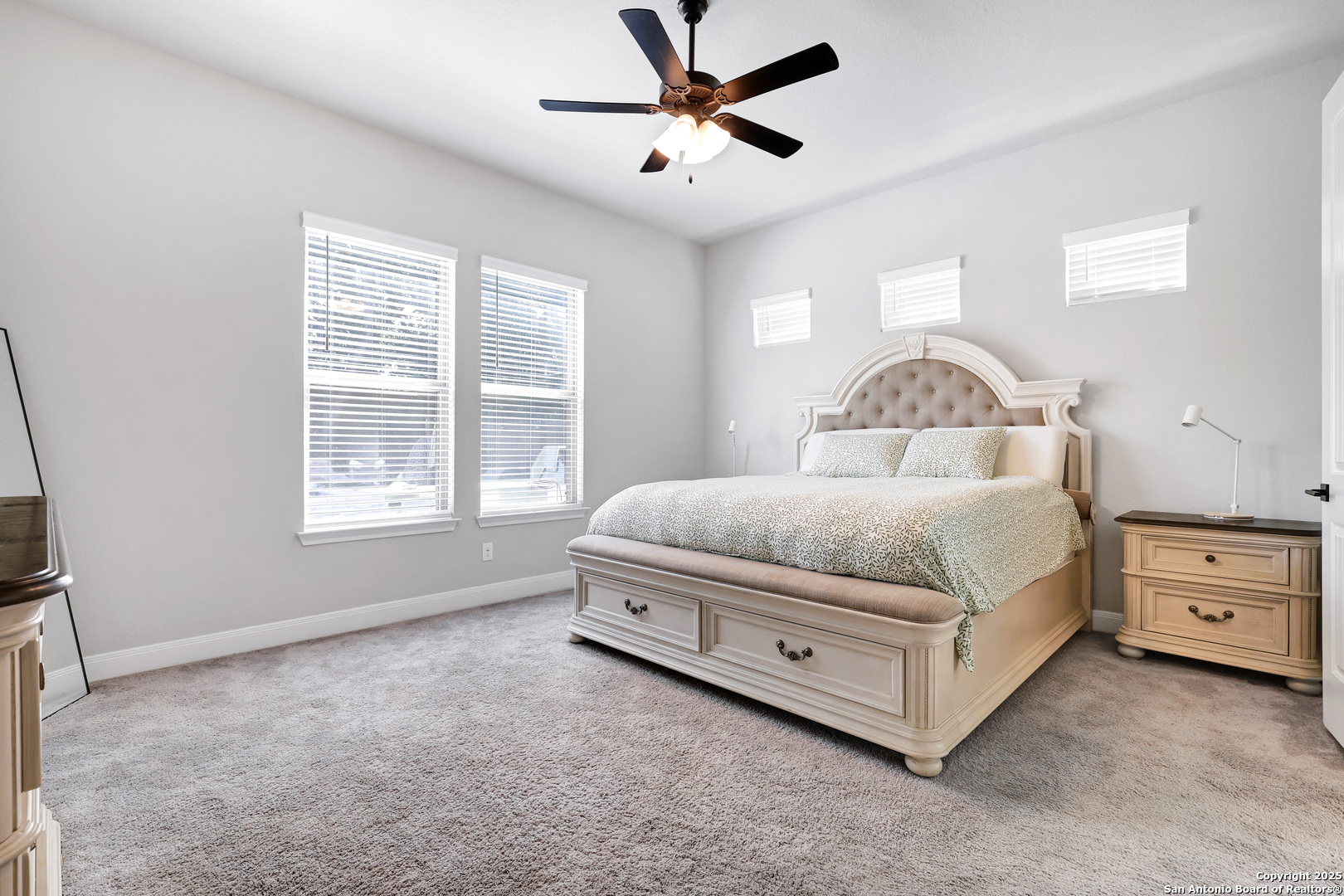 110 Giverny Boerne, TX 78006 - Photo 14 of 31 a bedroom with a bed dresser and a window