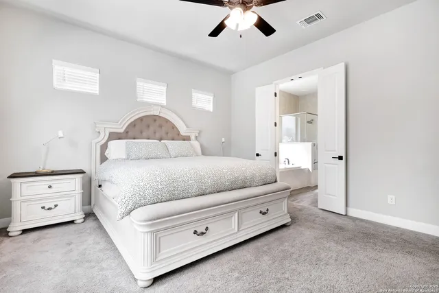 a bedroom with a bed and a dresser