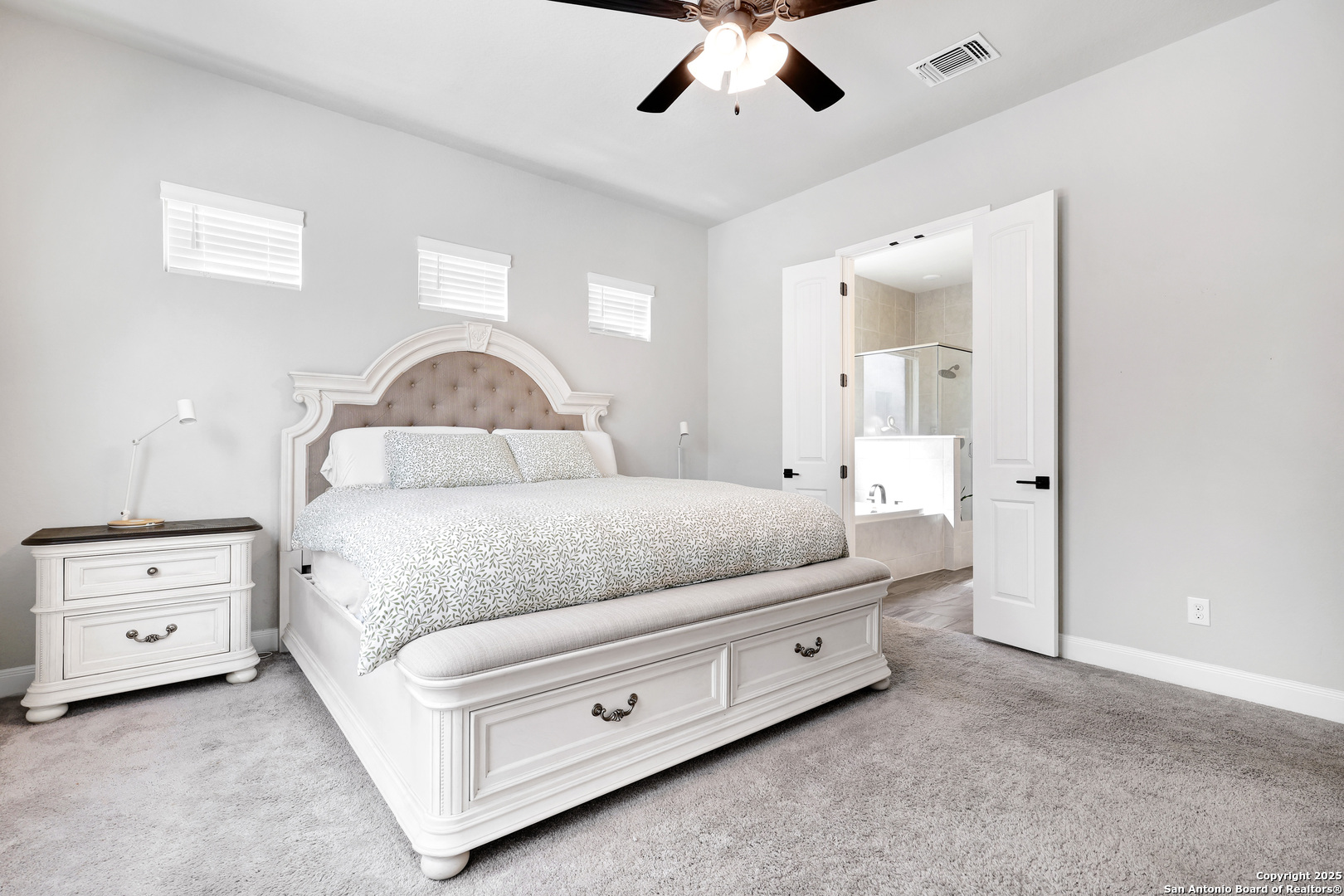 110 Giverny Boerne, TX 78006 - Photo 16 of 31 a bedroom with a bed and a dresser