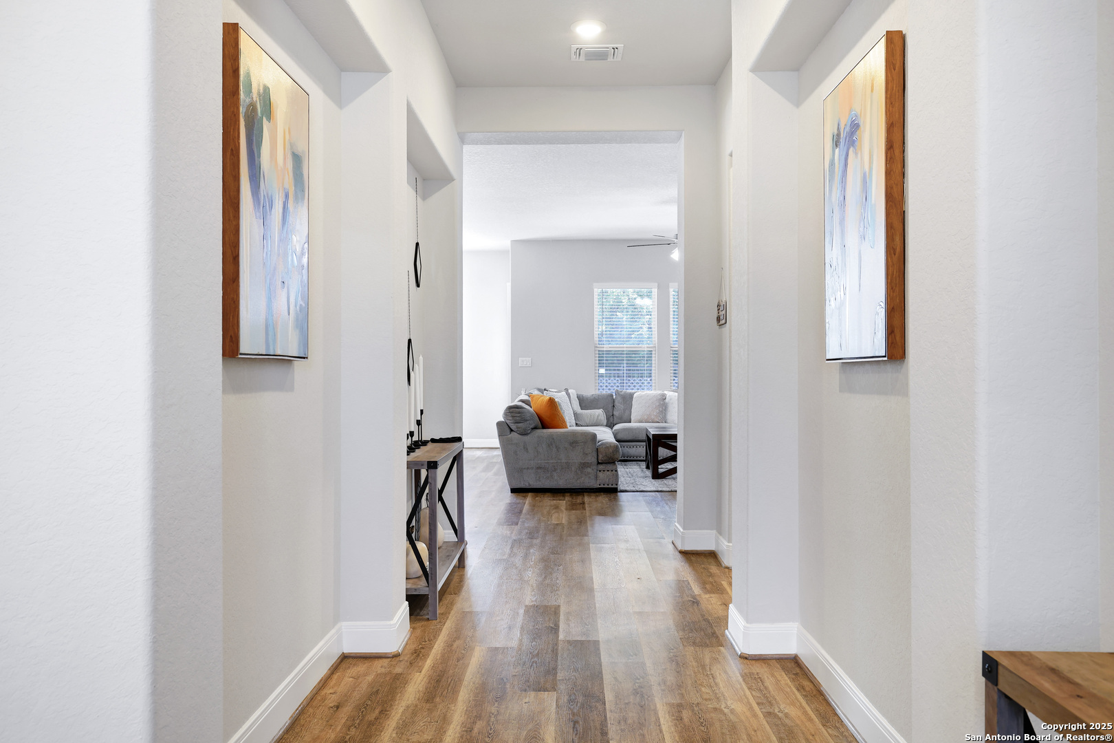 110 Giverny Boerne, TX 78006 - Photo 3 of 31 a hall way with wooden floor and furniture