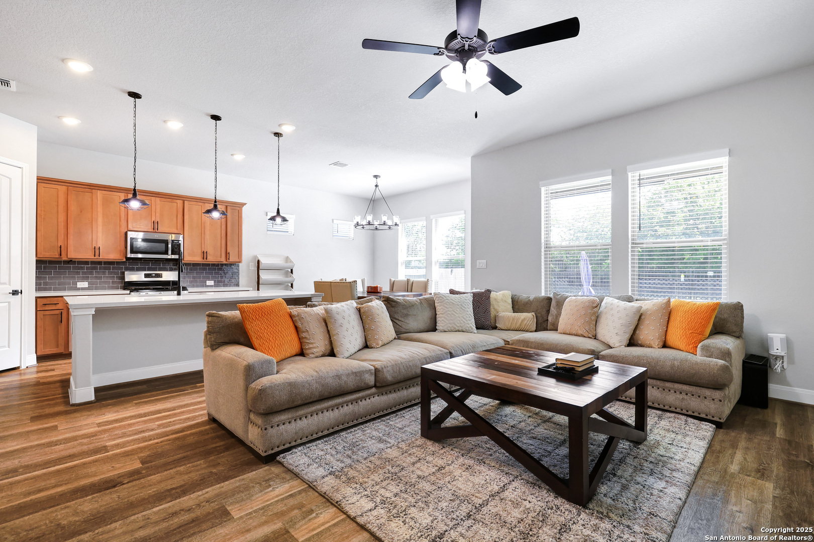 110 Giverny Boerne, TX 78006 - Photo 7 of 31 a living room with furniture kitchen view and a large window