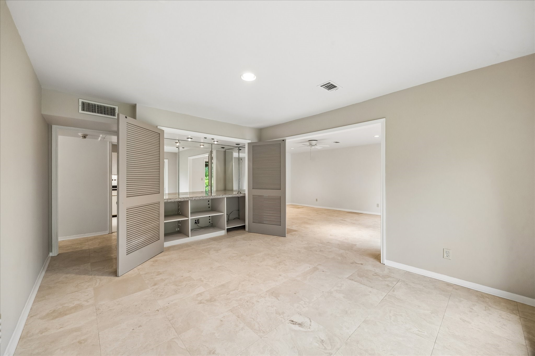 6659 Bayou Glen Road Houston, TX 77057 - Photo 9 of 23 In the home office, the doors open to reveal a wonderful bar or coffee/tea set up with it's granite stone counter and inset recessed lighting. This could also be great storage!