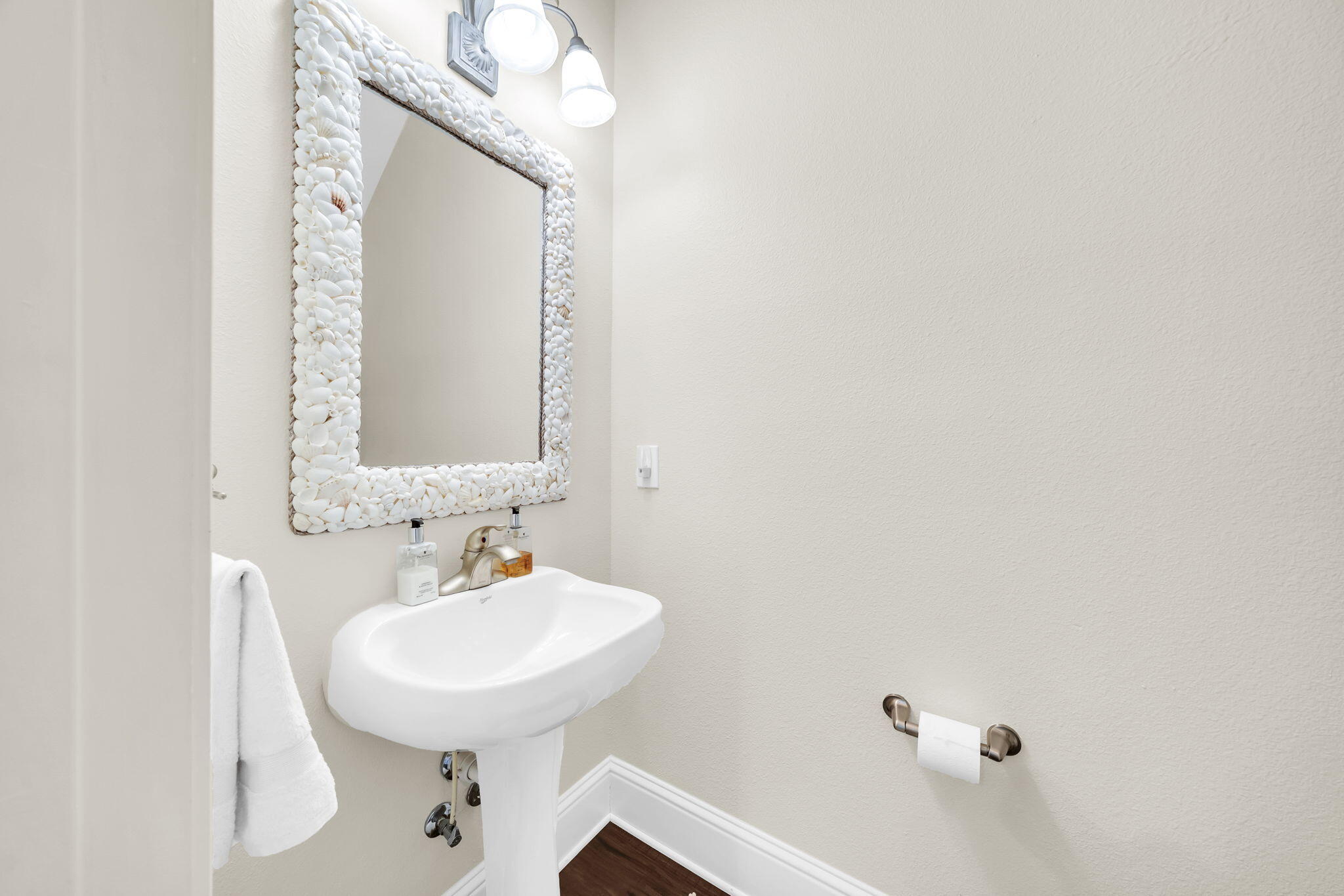 159 Golden Eagle Court, Unit 3C Santa Rosa Beach, FL 32459 - Photo 22 of 34 a bathroom with a sink and a mirror