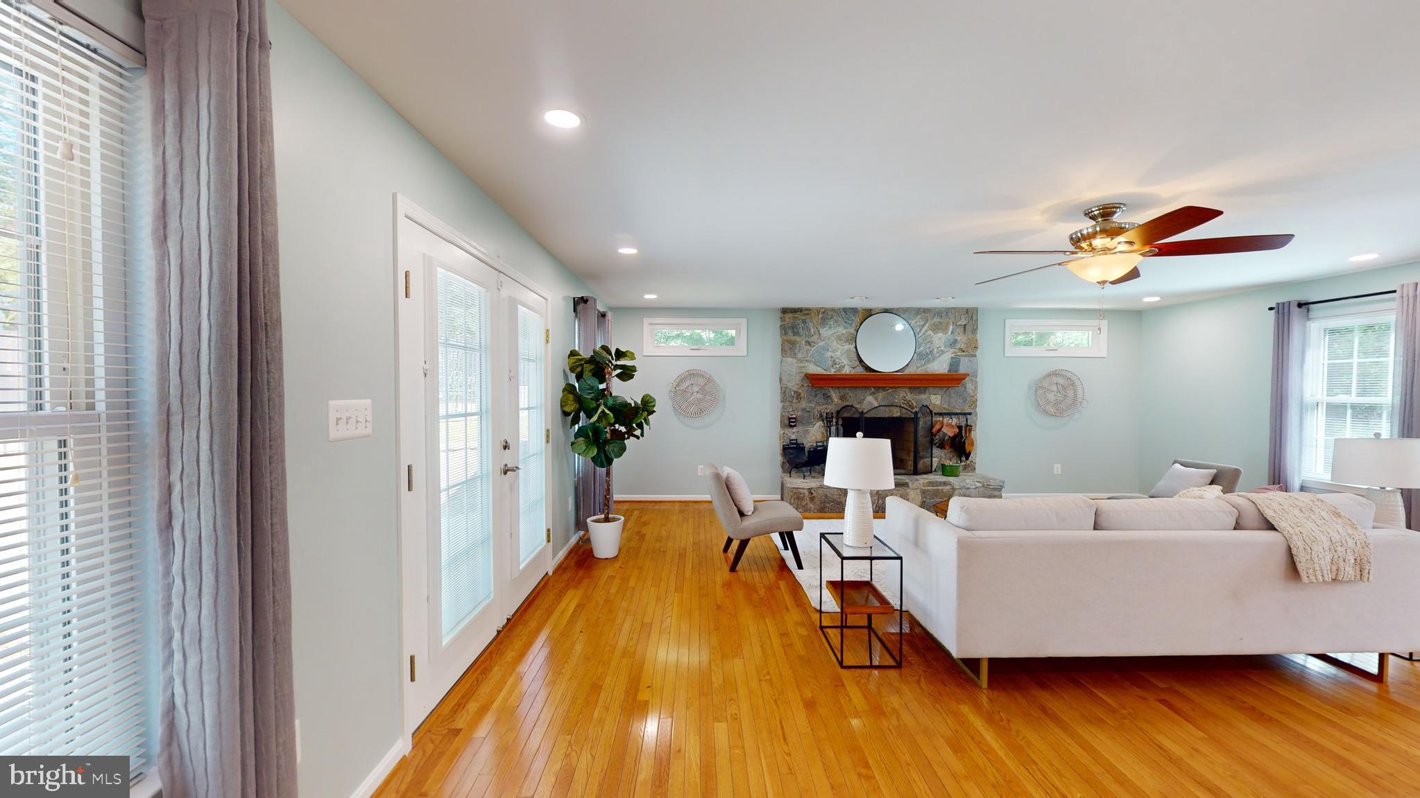 10600 Ward Road Dunkirk, MD 20754 - Photo 38 of 144 a living room with furniture and a fireplace