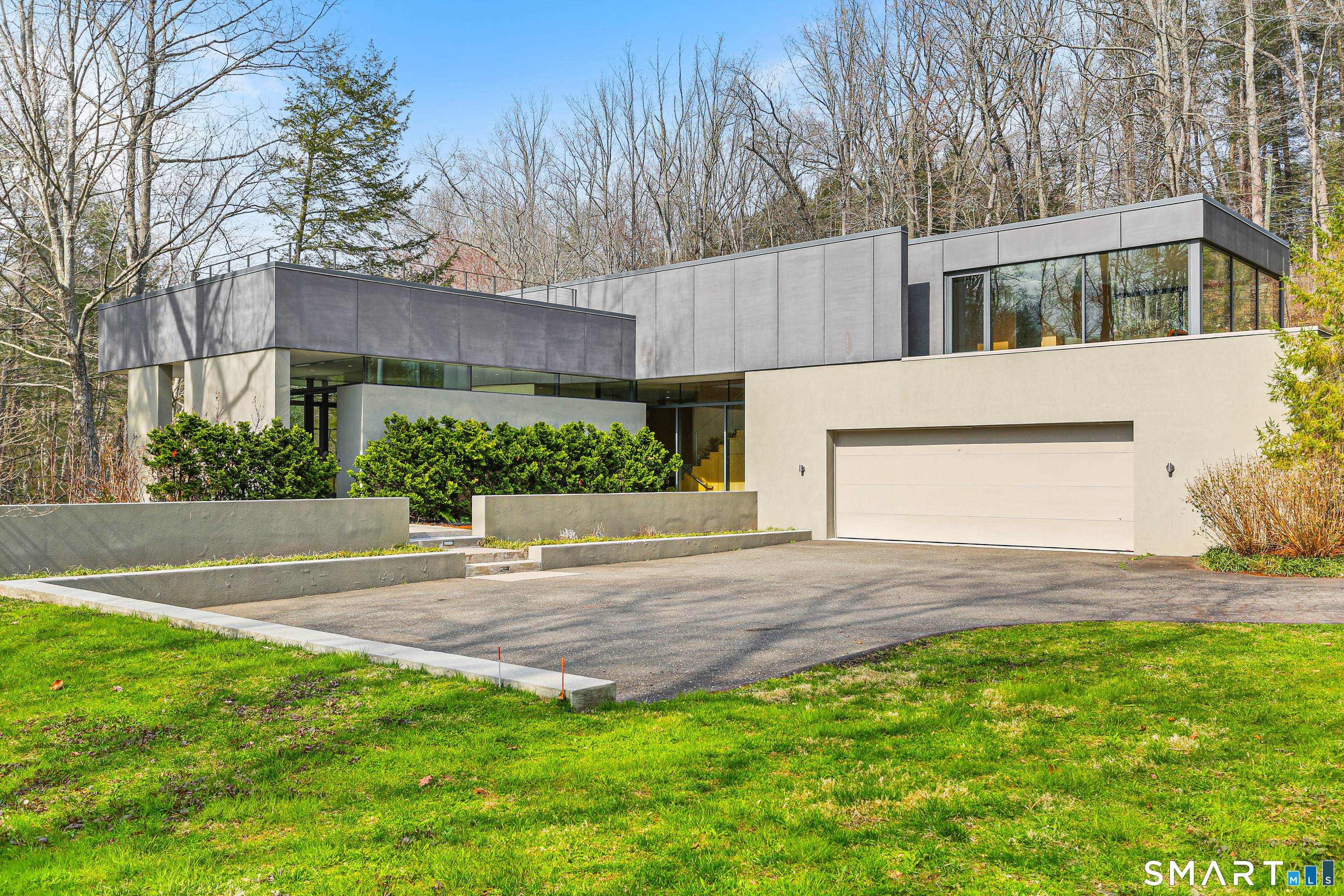 52 Valley Forge Road Weston, CT 06883 - Photo 1 of 38 a view of a house with a yard and a garage