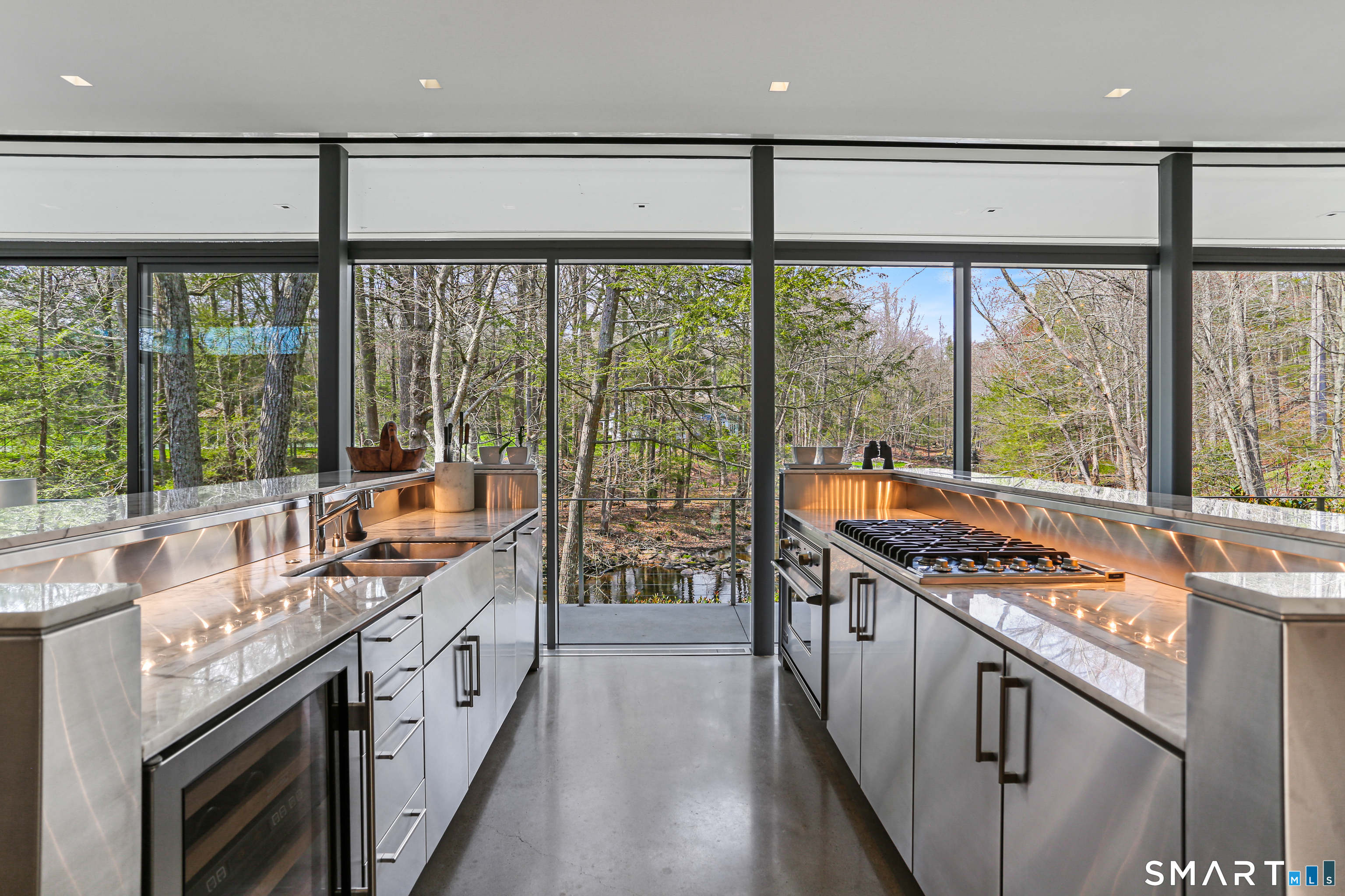 52 Valley Forge Road Weston, CT 06883 - Photo 11 of 38 a kitchen with stainless steel appliances granite countertop a sink and a stove