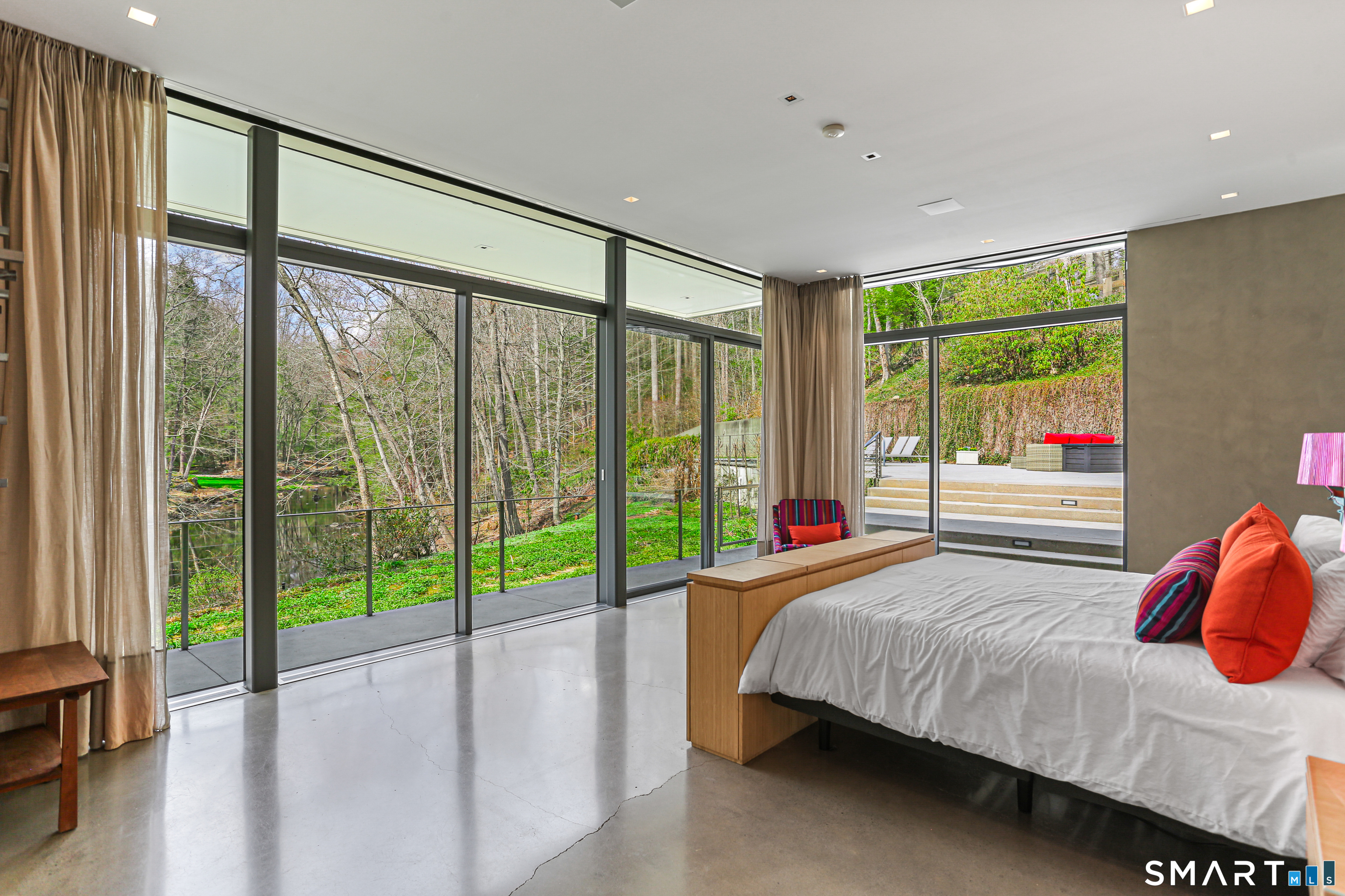 52 Valley Forge Road Weston, CT 06883 - Photo 16 of 38 a bedroom with a large window and a bed