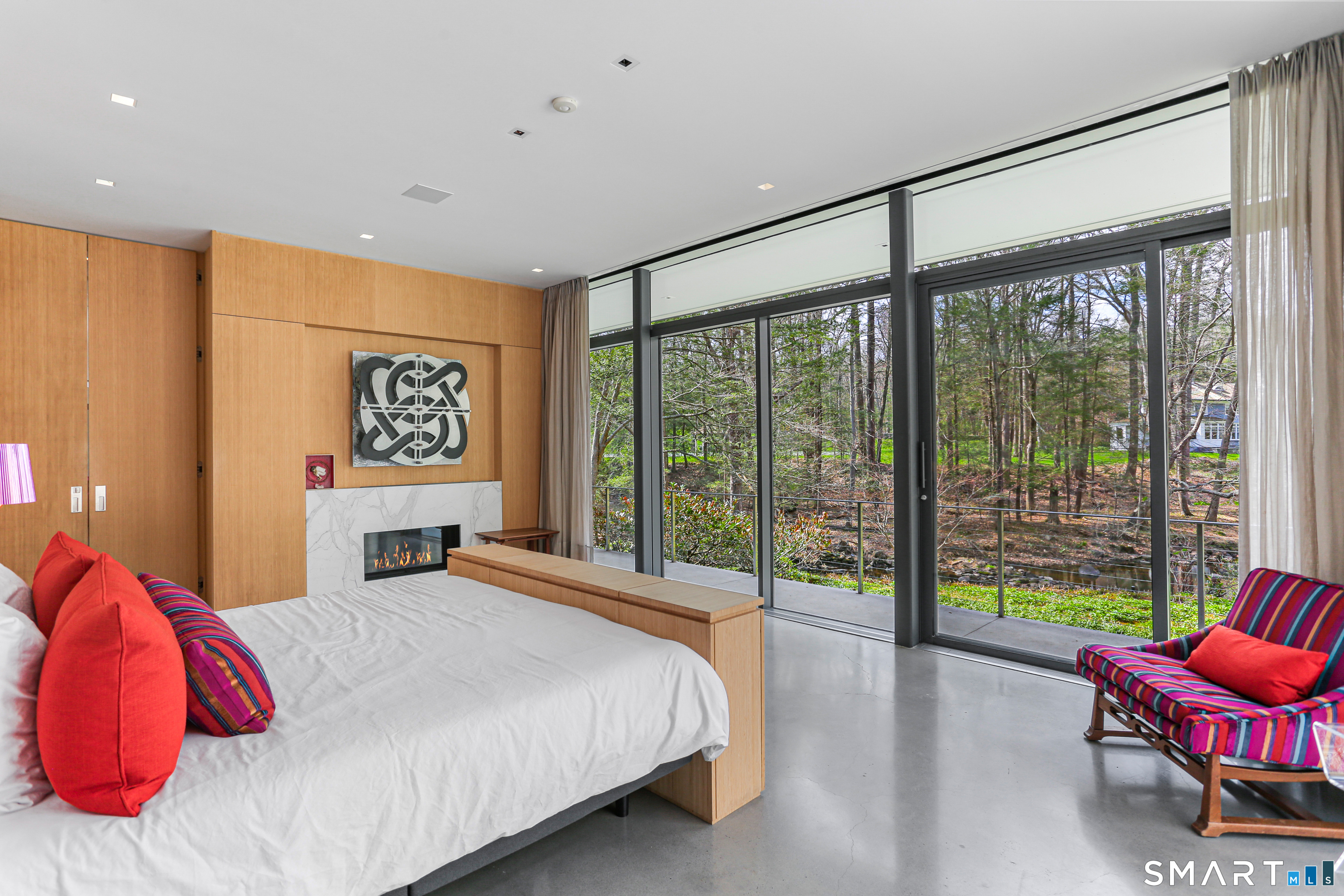 52 Valley Forge Road Weston, CT 06883 - Photo 17 of 38 a bedroom with a large bed and a large window
