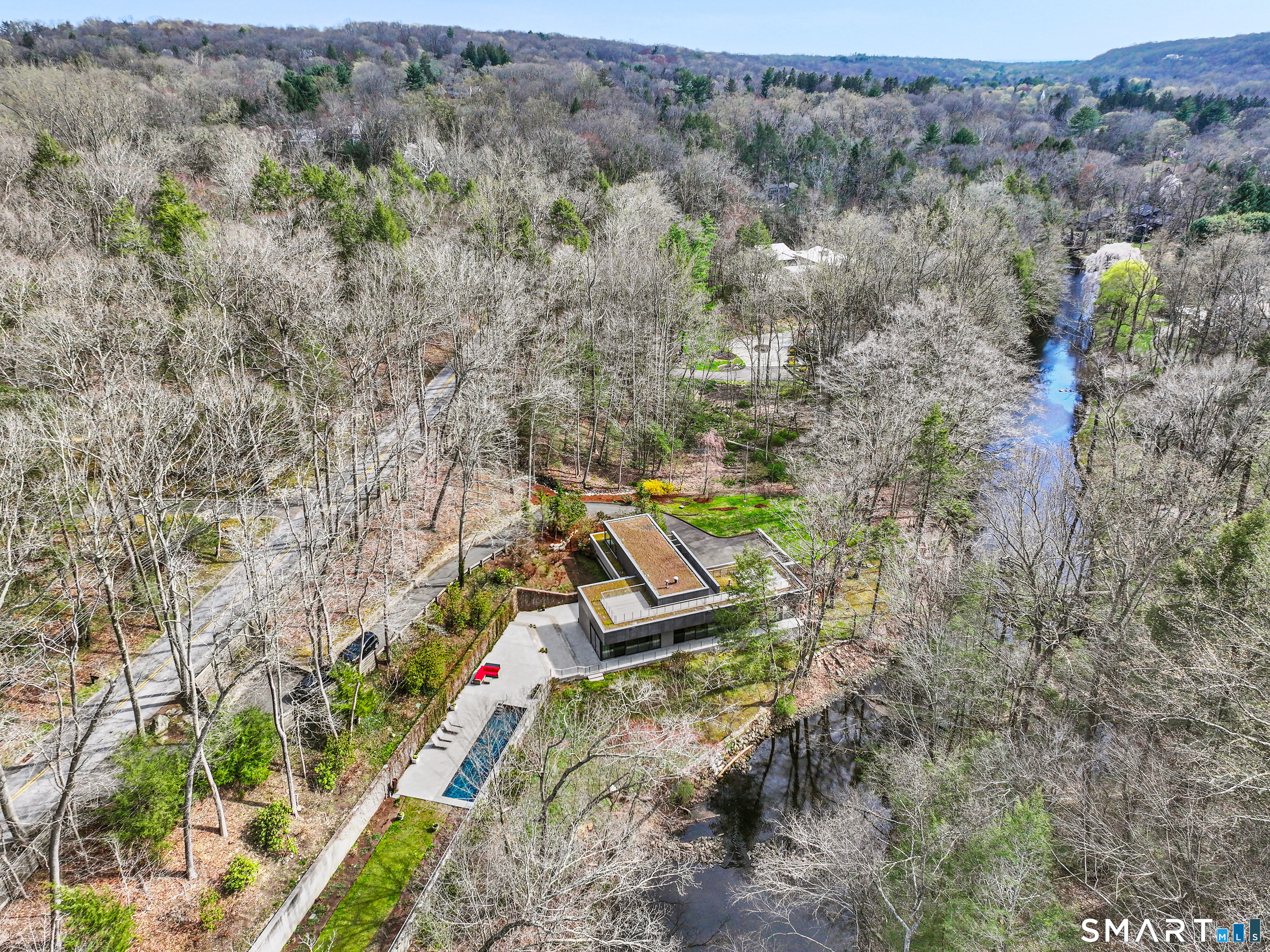 52 Valley Forge Road Weston, CT 06883 - Photo 2 of 38 an aerial view of a forest with houses