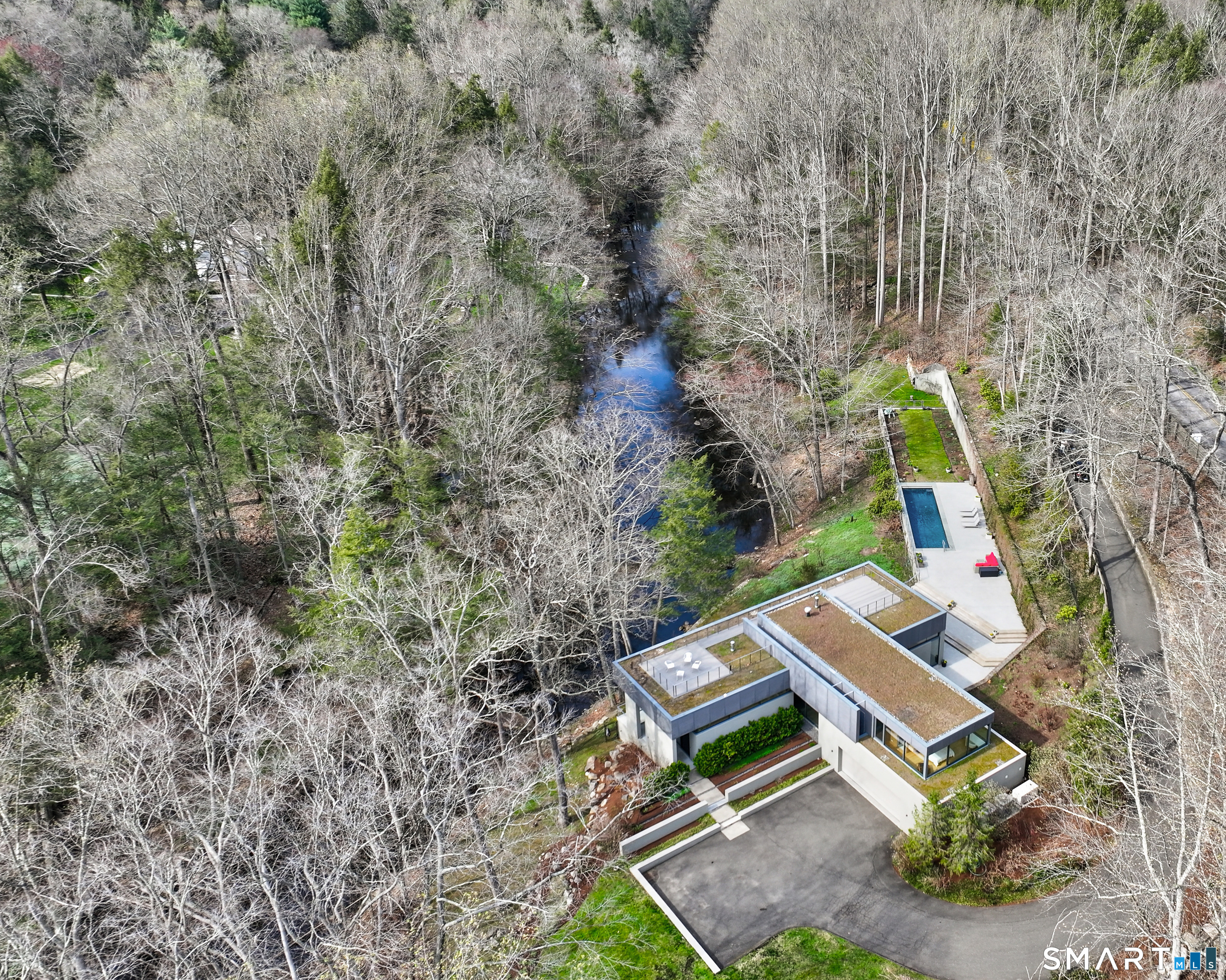 52 Valley Forge Road Weston, CT 06883 - Photo 36 of 38 a view of a house with a yard