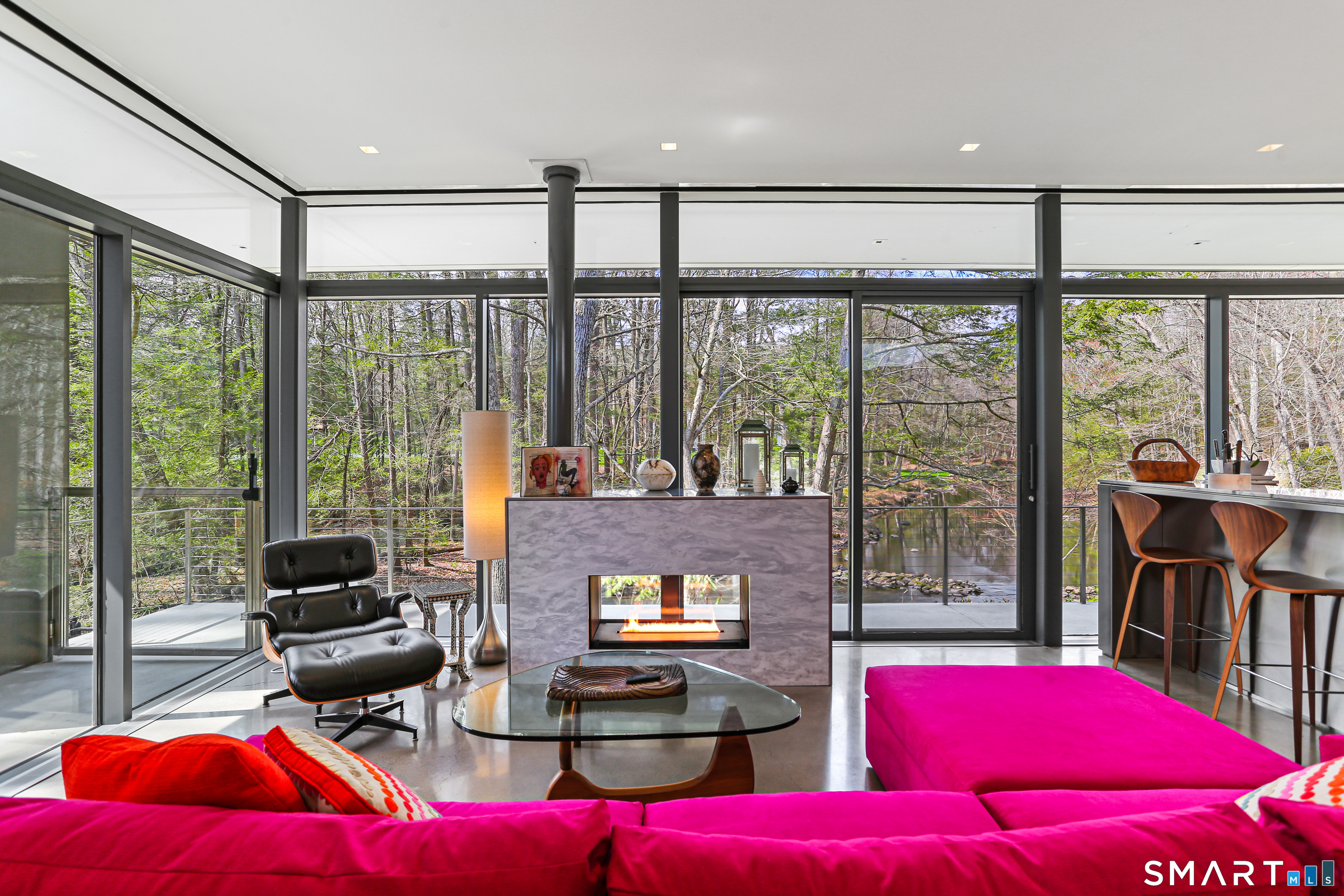 52 Valley Forge Road Weston, CT 06883 - Photo 6 of 38 a living room with furniture and floor to ceiling windows