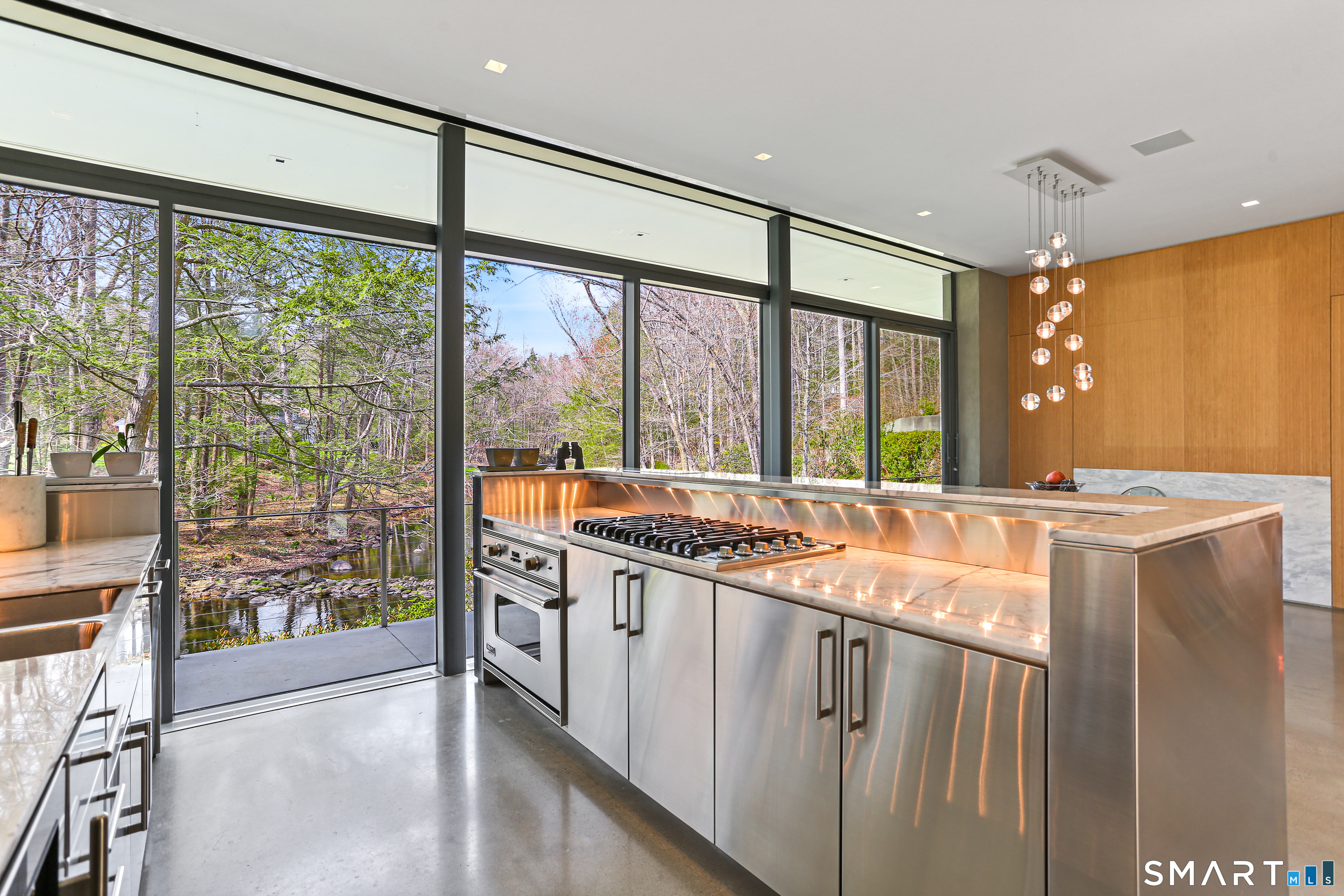 52 Valley Forge Road Weston, CT 06883 - Photo 10 of 38 a kitchen with a large window and a sink