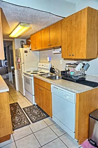 a bathroom with a toilet sink and curtain
