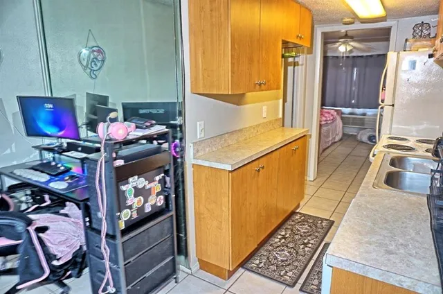 a room with a sink cabinets and utility