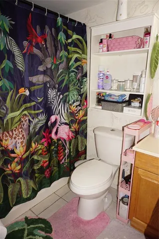 a room with furniture and a floor to ceiling window