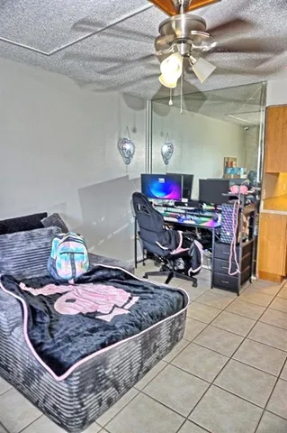 a bedroom with a bed and a couch