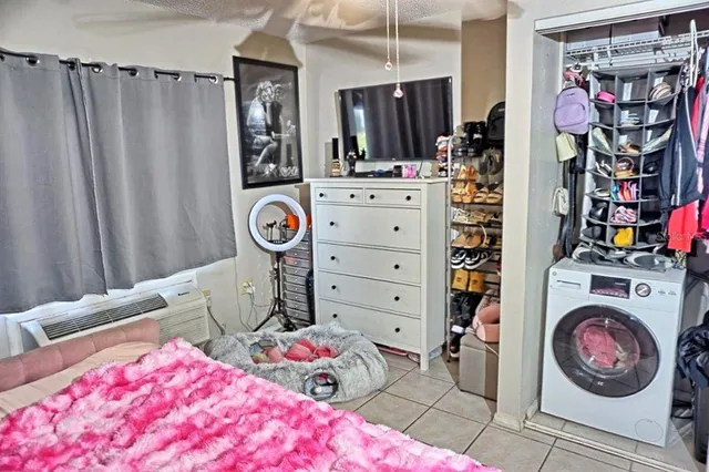 a kitchen with a stove and a white refrigerator