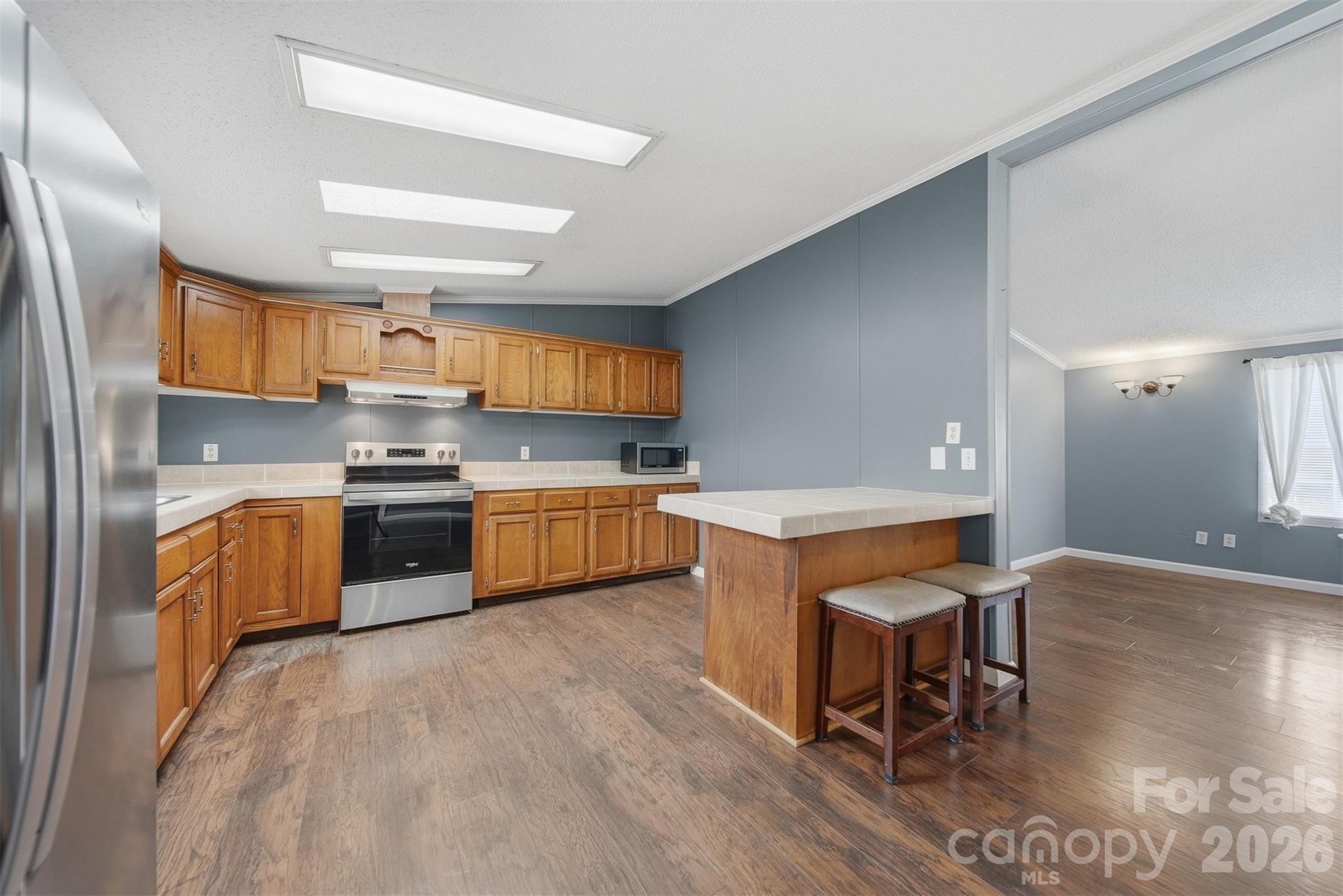 315 West McDowell Street Morganton, NC 28655 - Photo 11 of 48 a kitchen with stainless steel appliances kitchen island granite countertop a sink counter space and cabinets