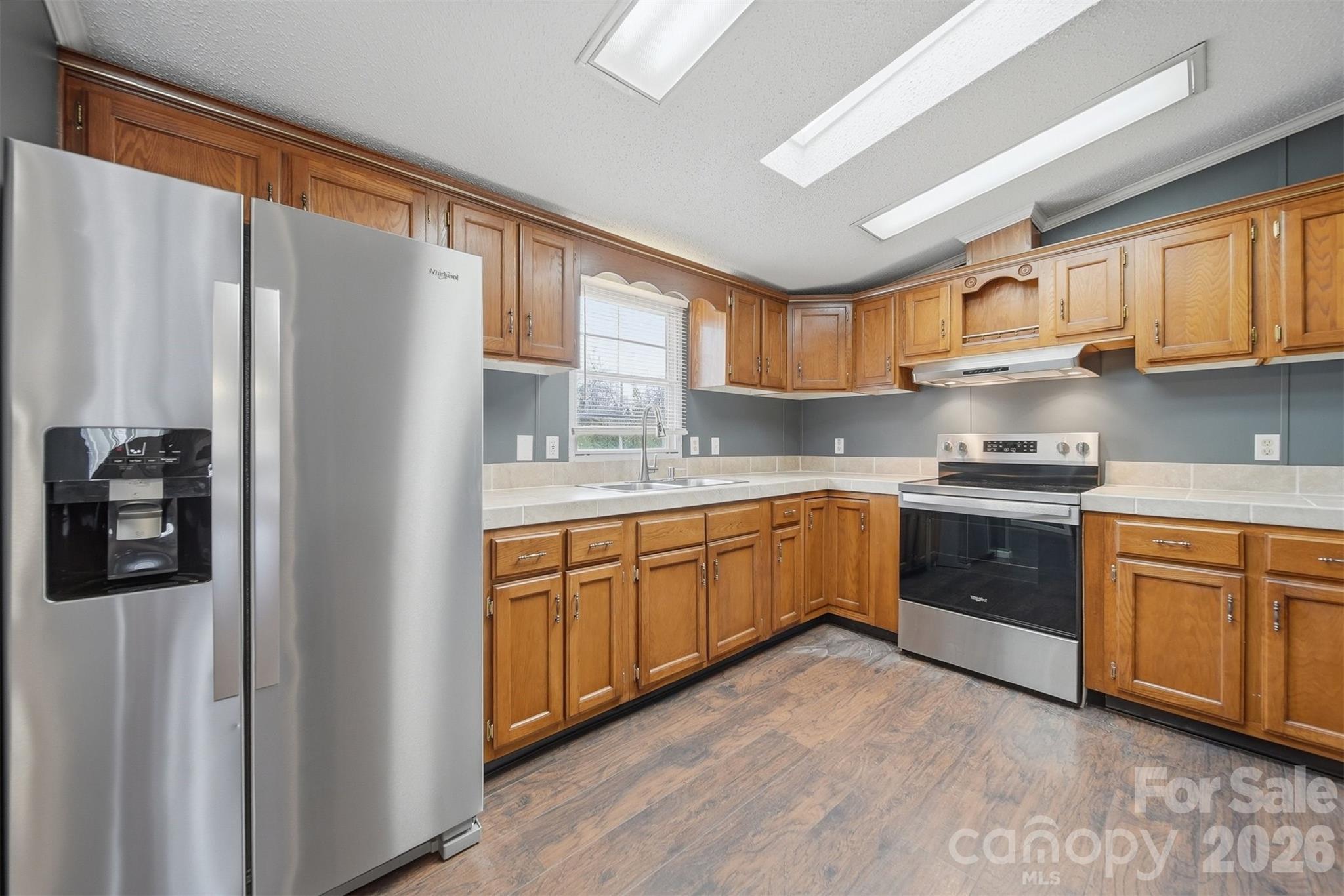 315 West McDowell Street Morganton, NC 28655 - Photo 13 of 48 a kitchen with stainless steel appliances granite countertop a refrigerator sink and cabinets