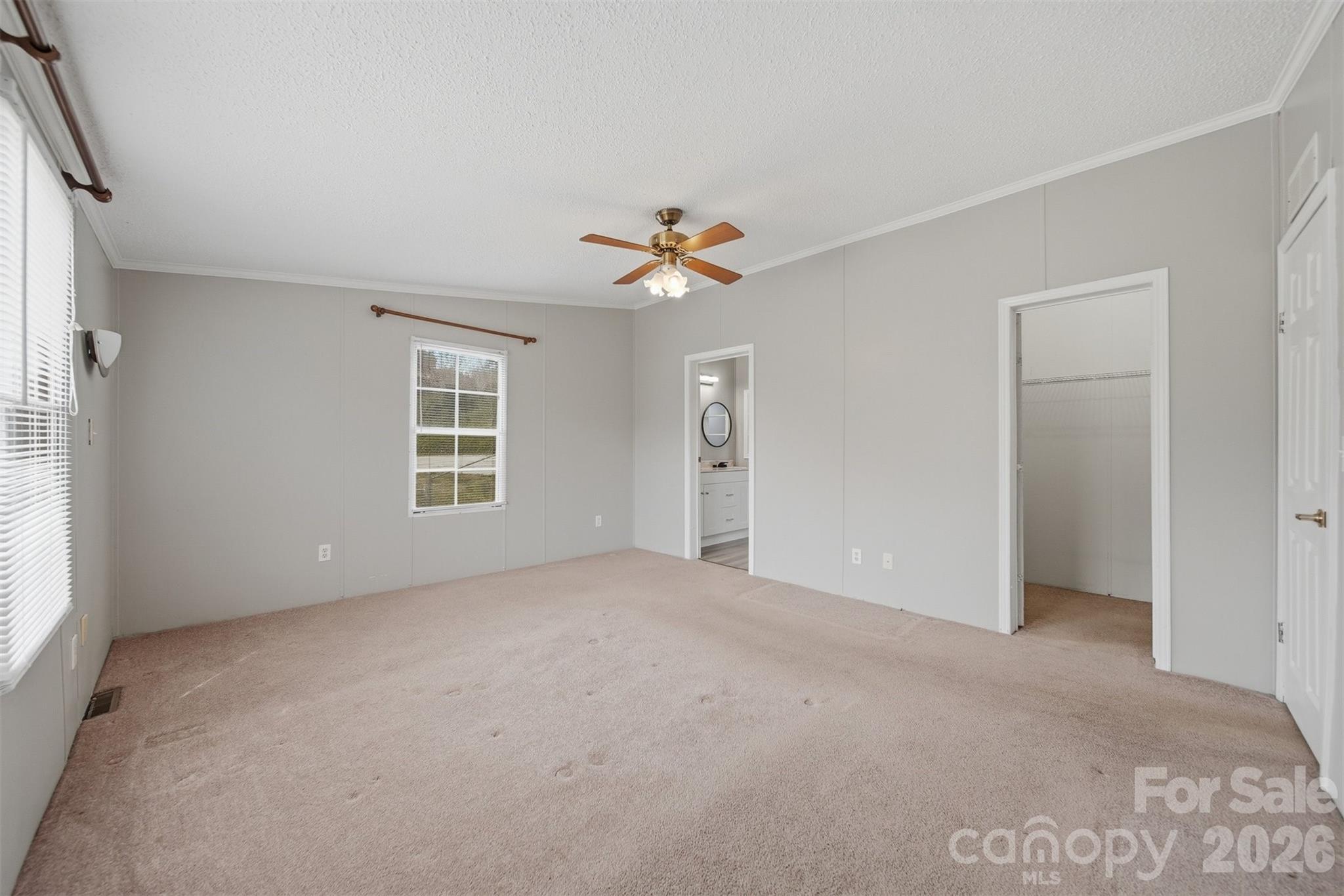 315 West McDowell Street Morganton, NC 28655 - Photo 20 of 48 an empty room with windows and fan
