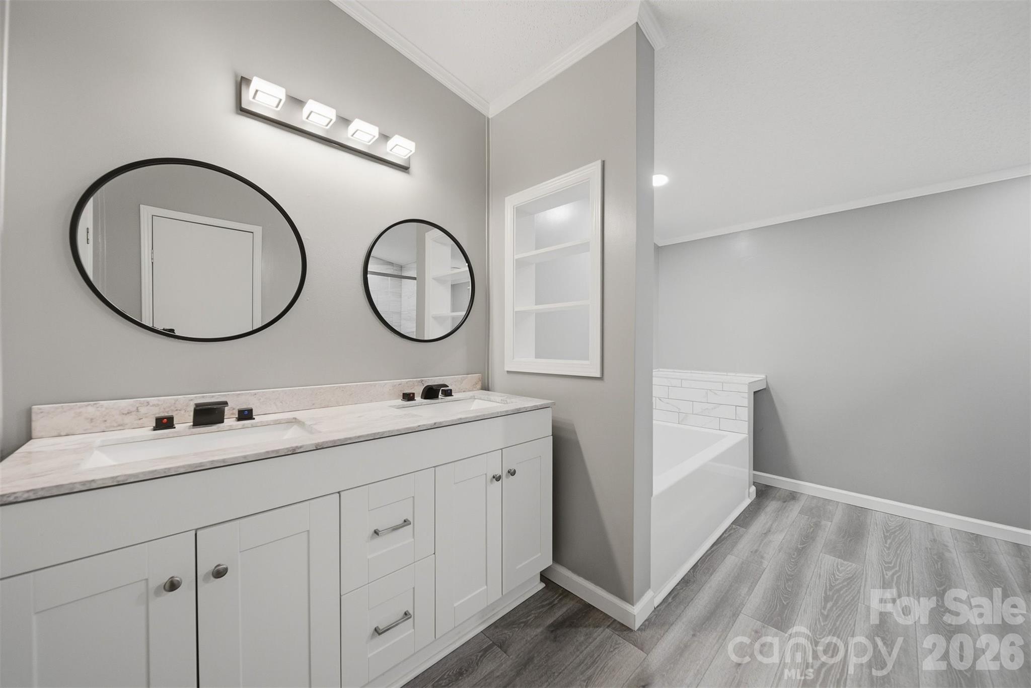 315 West McDowell Street Morganton, NC 28655 - Photo 23 of 48 a bathroom with a double vanity sink and a mirror