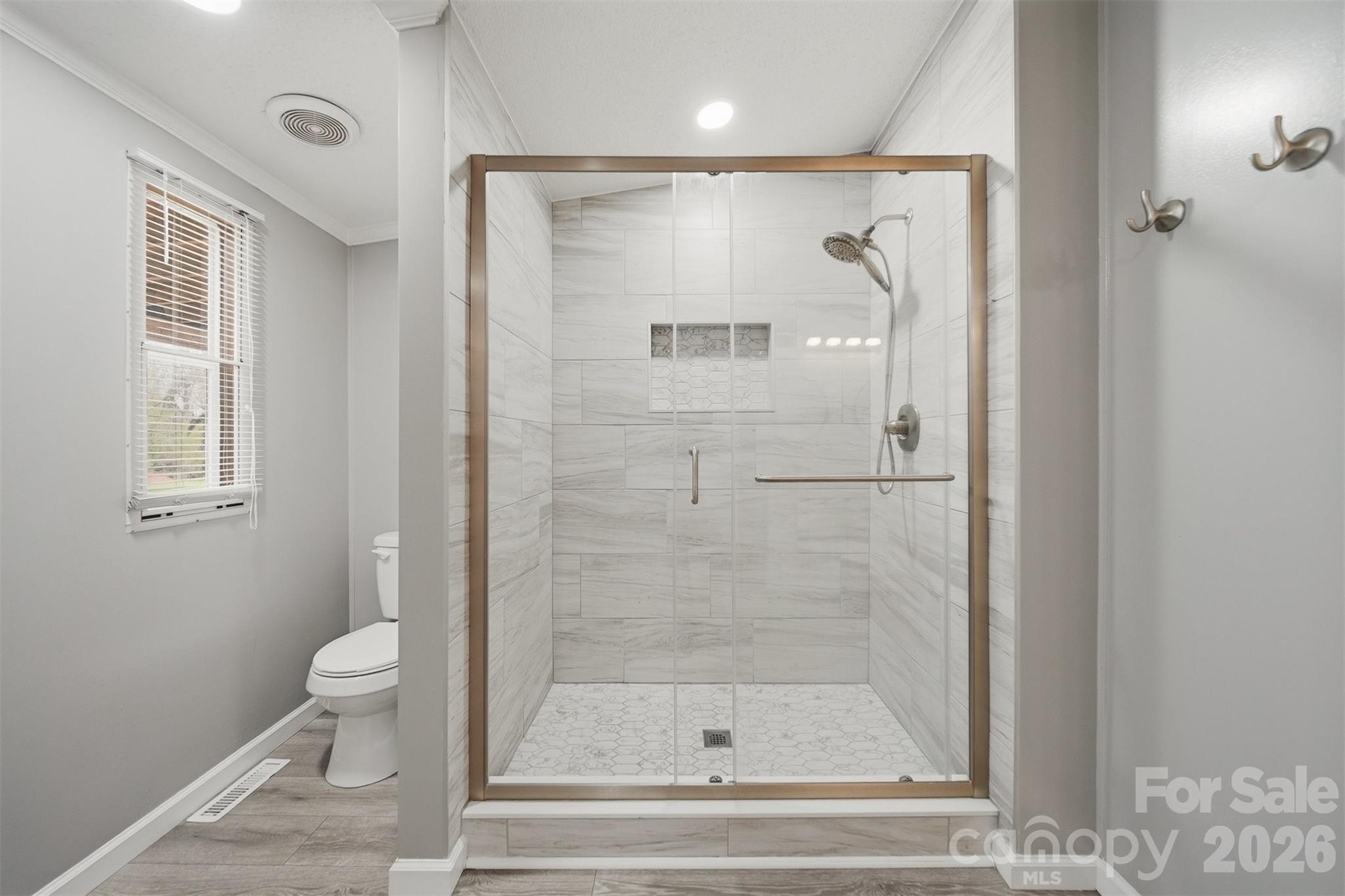 315 West McDowell Street Morganton, NC 28655 - Photo 25 of 48 a bathroom with a shower and toilet