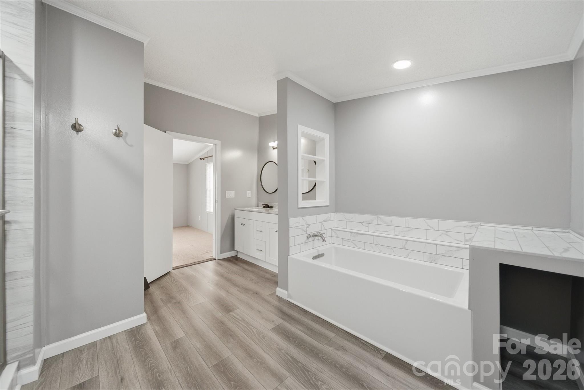 315 West McDowell Street Morganton, NC 28655 - Photo 26 of 48 a spacious bathroom with a shower sink and mirror