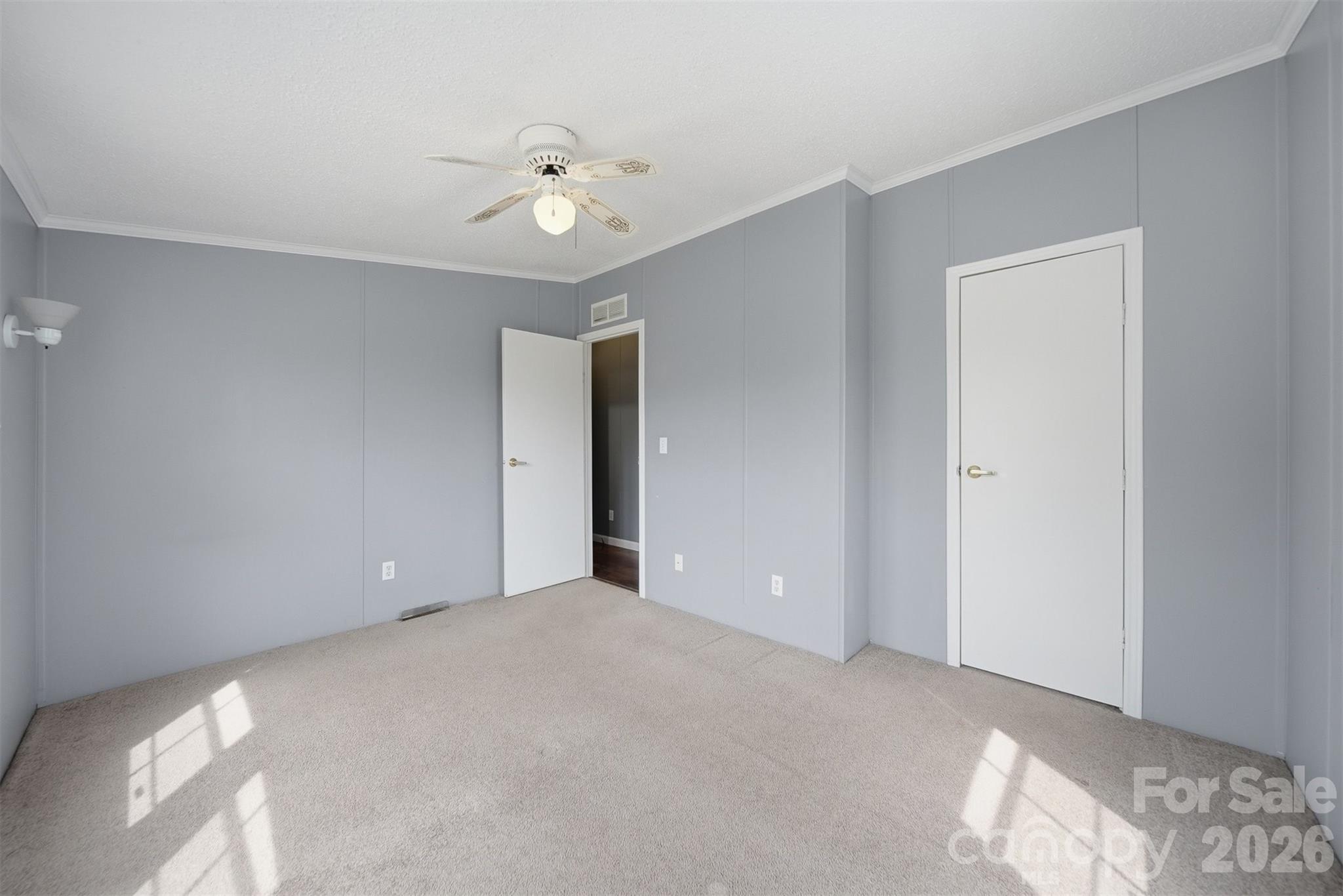 315 West McDowell Street Morganton, NC 28655 - Photo 28 of 48 a view of an empty room with a chandelier fan