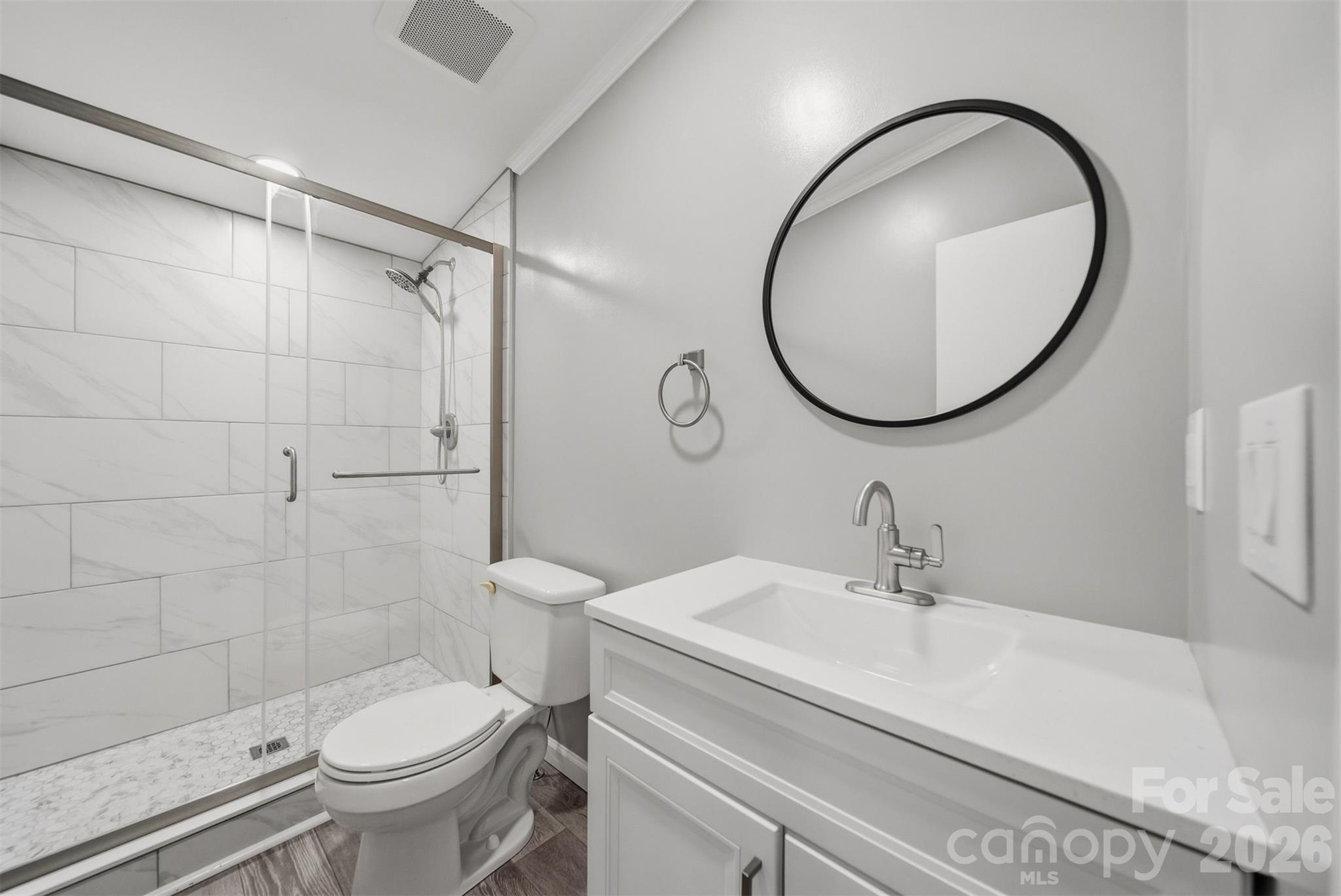 315 West McDowell Street Morganton, NC 28655 - Photo 33 of 48 a bathroom with a sink a toilet and a mirror