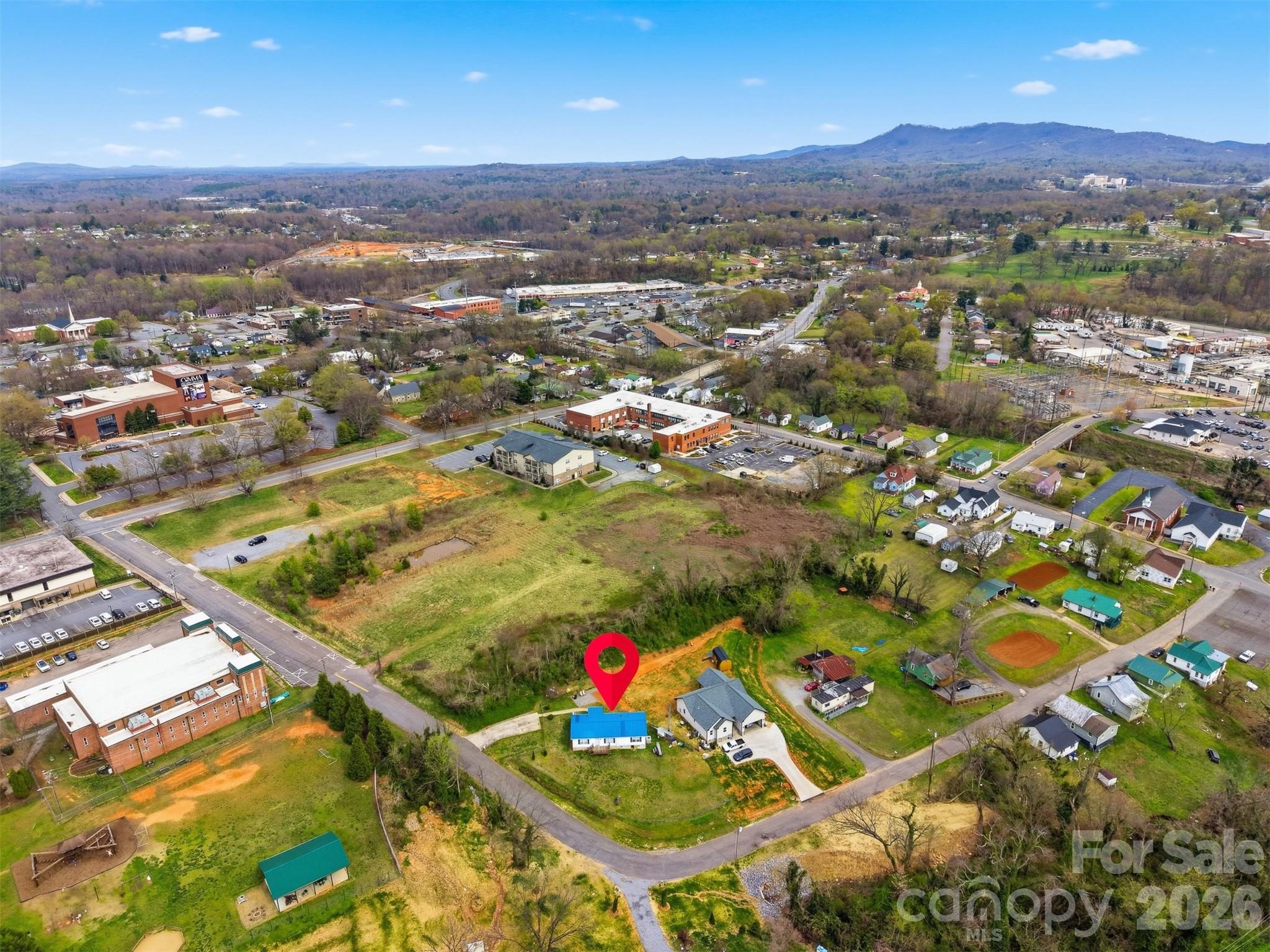 315 West McDowell Street Morganton, NC 28655 - Photo 45 of 48 an aerial view of residential houses with outdoor space and trees