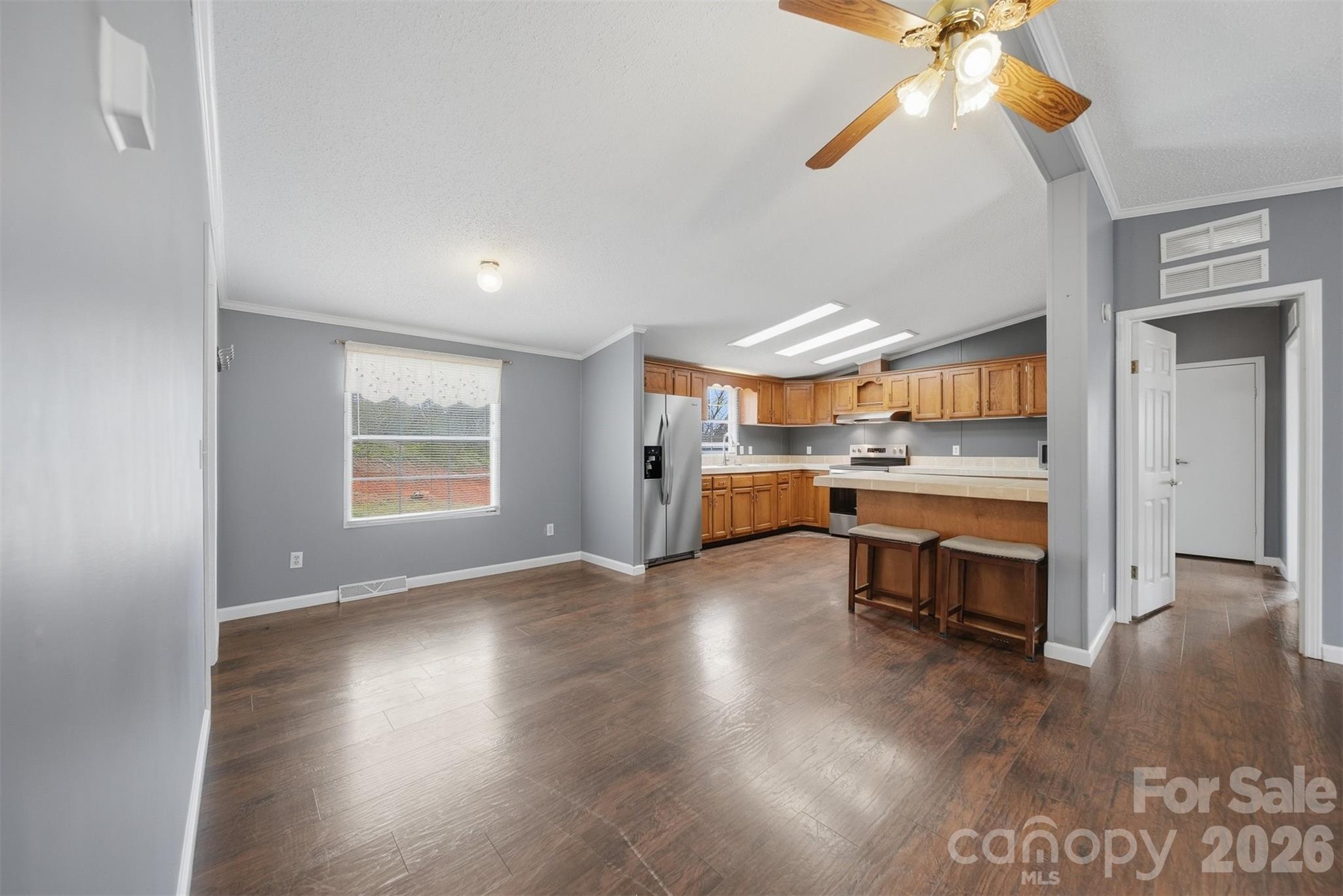 315 West McDowell Street Morganton, NC 28655 - Photo 6 of 48 an empty room with wooden floor and windows