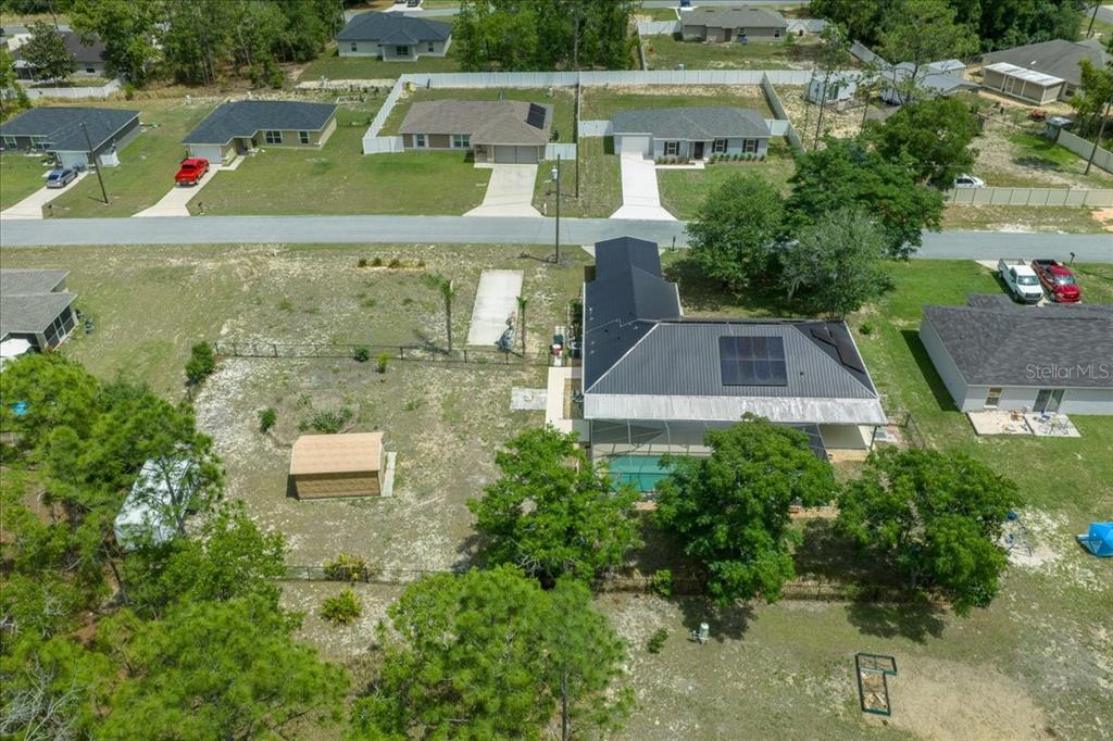 234 Locust Lane Ocala, FL 34472 - Photo 7 of 71 an aerial view of a house with a yard and lake view