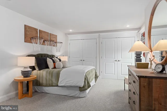 a bedroom with a bed and a table