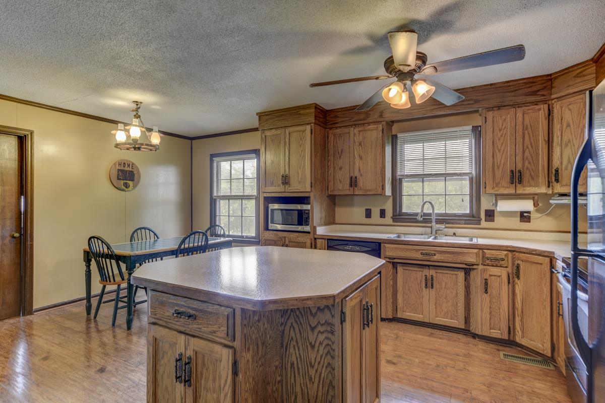 6246 Arno Road Franklin, TN 37064 - Photo 11 of 29 a kitchen with a table chairs sink and cabinets
