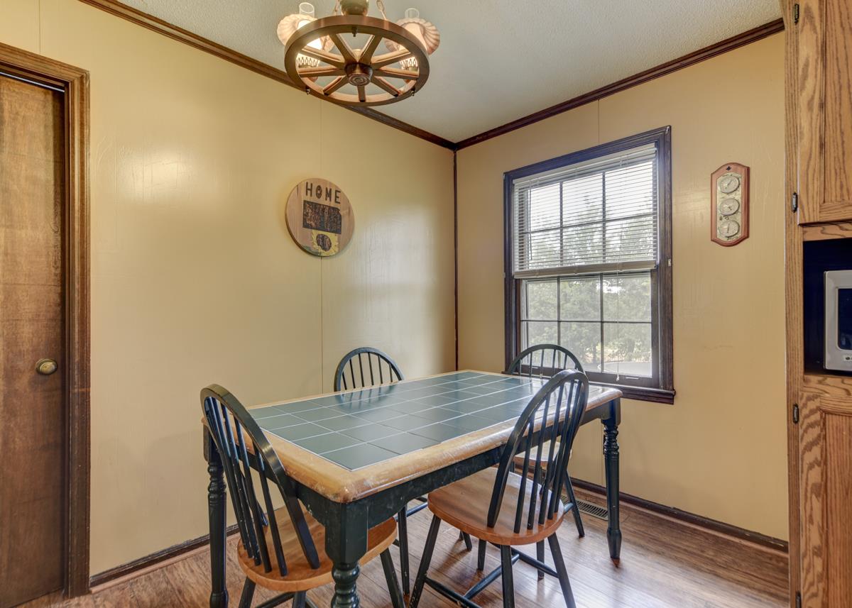 6246 Arno Road Franklin, TN 37064 - Photo 12 of 29 a view of a dining room with furniture and window