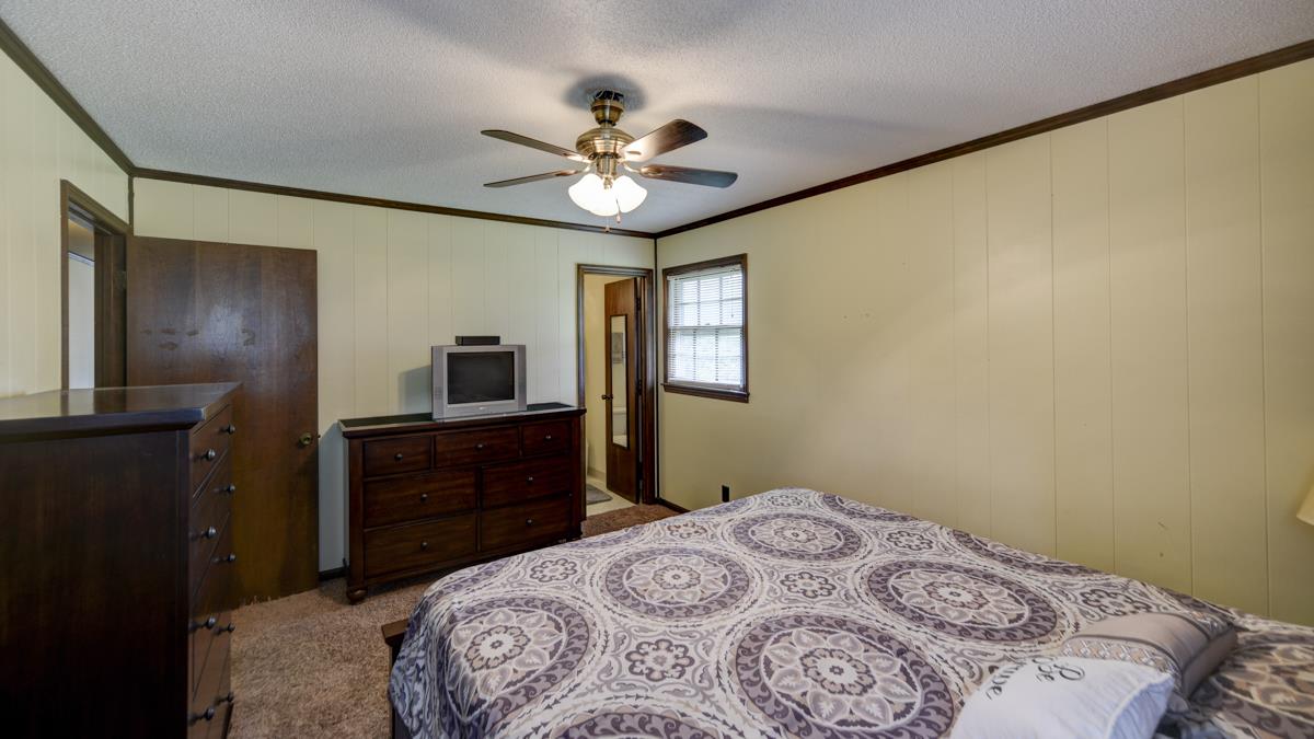 6246 Arno Road Franklin, TN 37064 - Photo 15 of 29 a bedroom with a bed and a dresser
