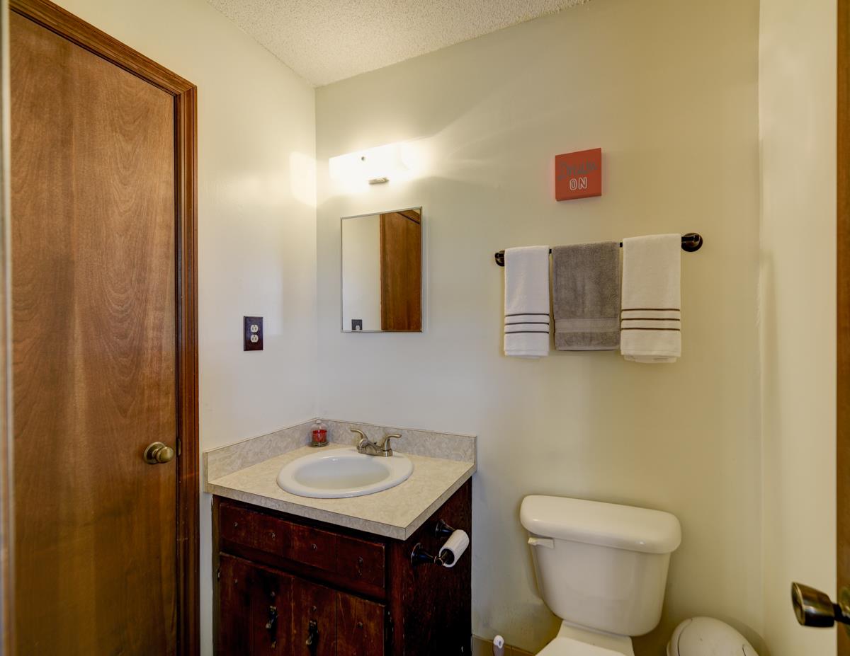 6246 Arno Road Franklin, TN 37064 - Photo 16 of 29 a bathroom with a toilet sink and mirror