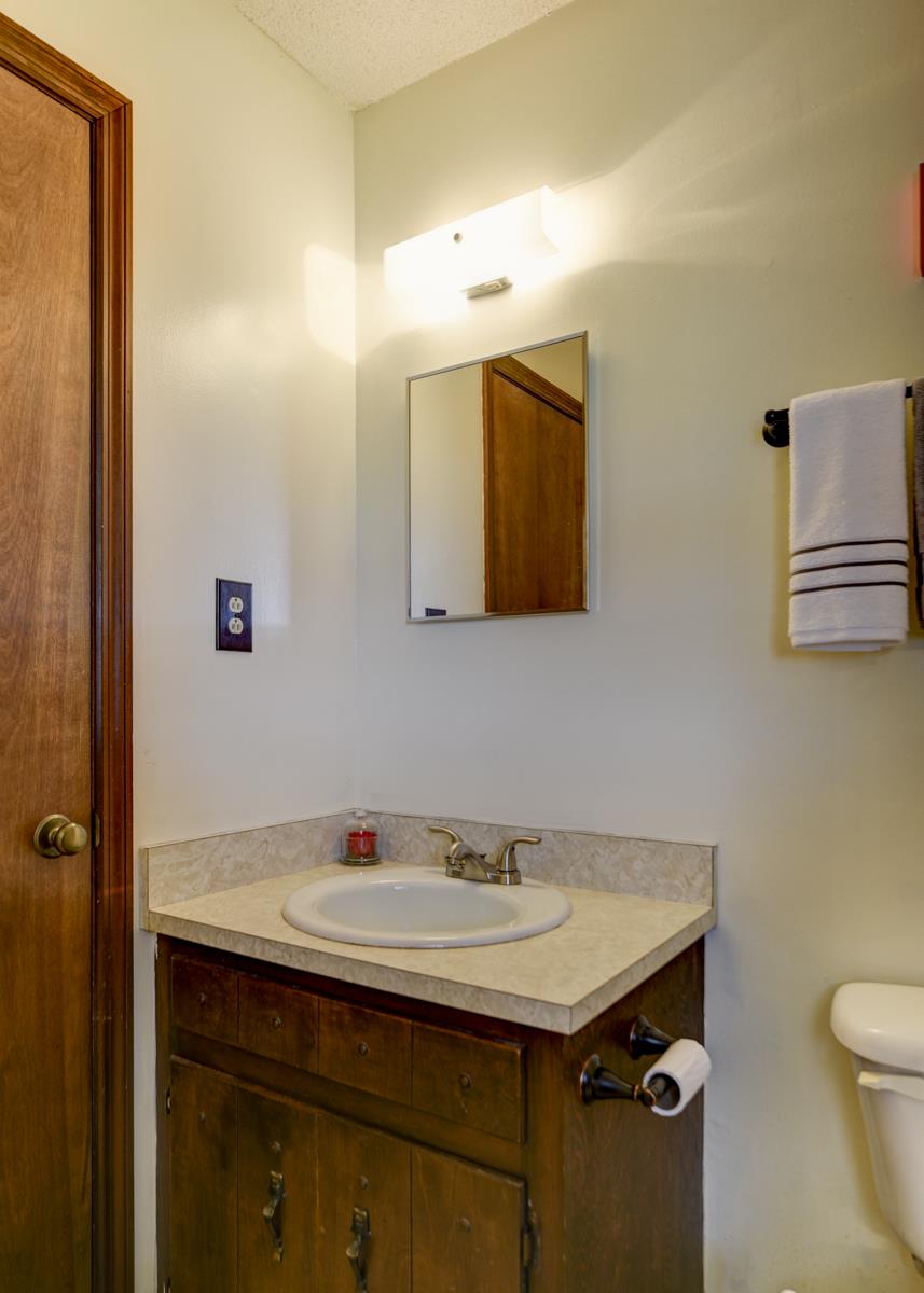 6246 Arno Road Franklin, TN 37064 - Photo 17 of 29 a bathroom with a sink and a mirror