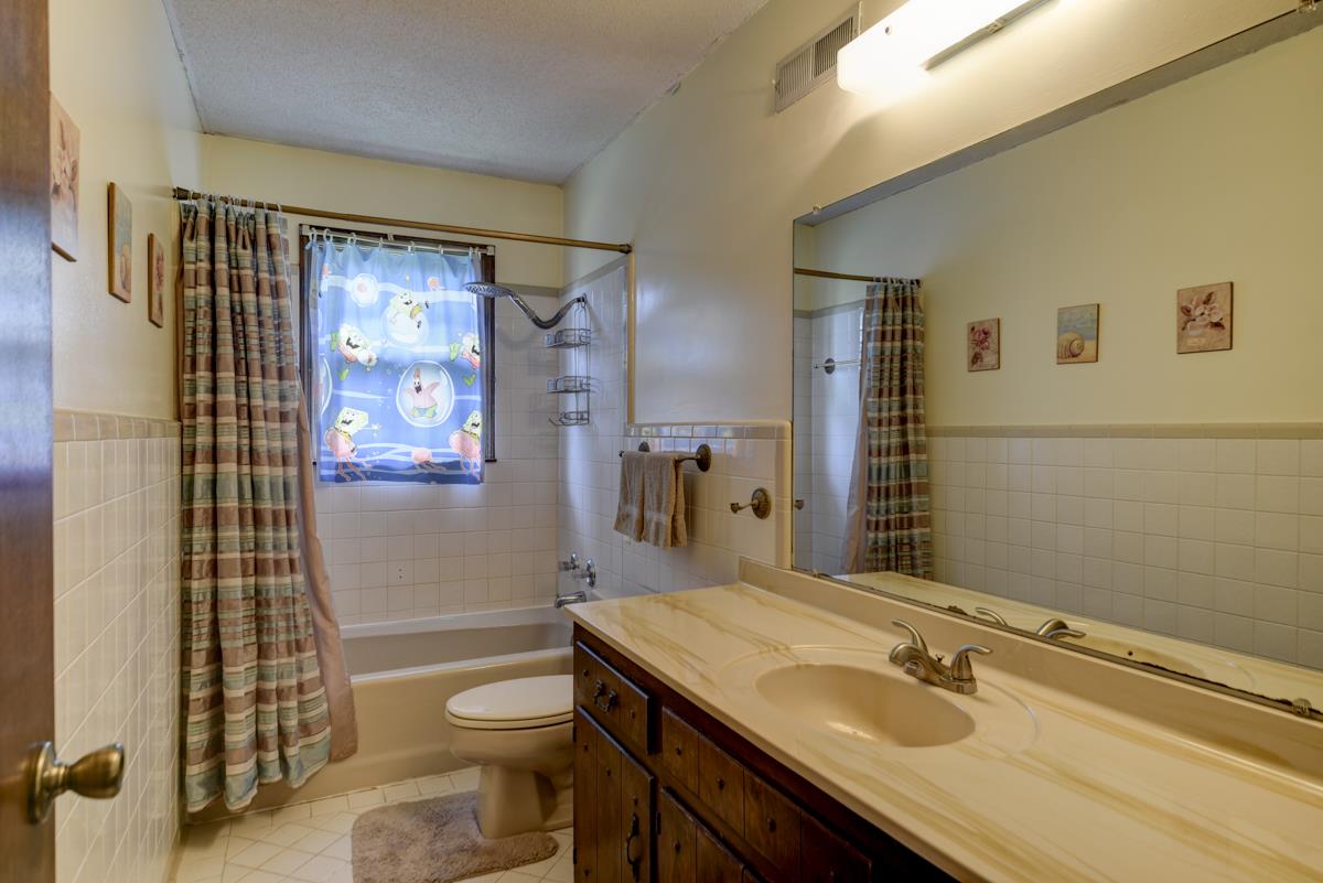 6246 Arno Road Franklin, TN 37064 - Photo 19 of 29 a bathroom with a sink toilet vanity and shower