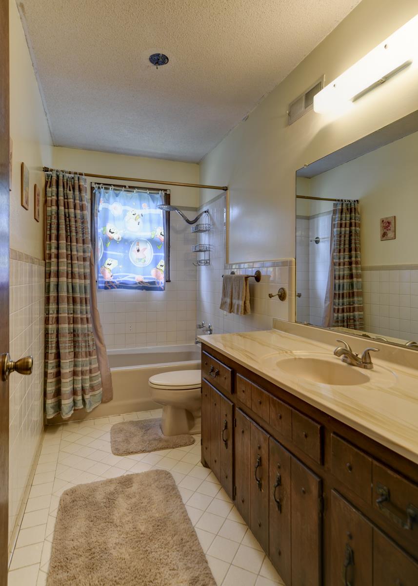 6246 Arno Road Franklin, TN 37064 - Photo 20 of 29 a spacious bathroom with a granite countertop sink and a mirror